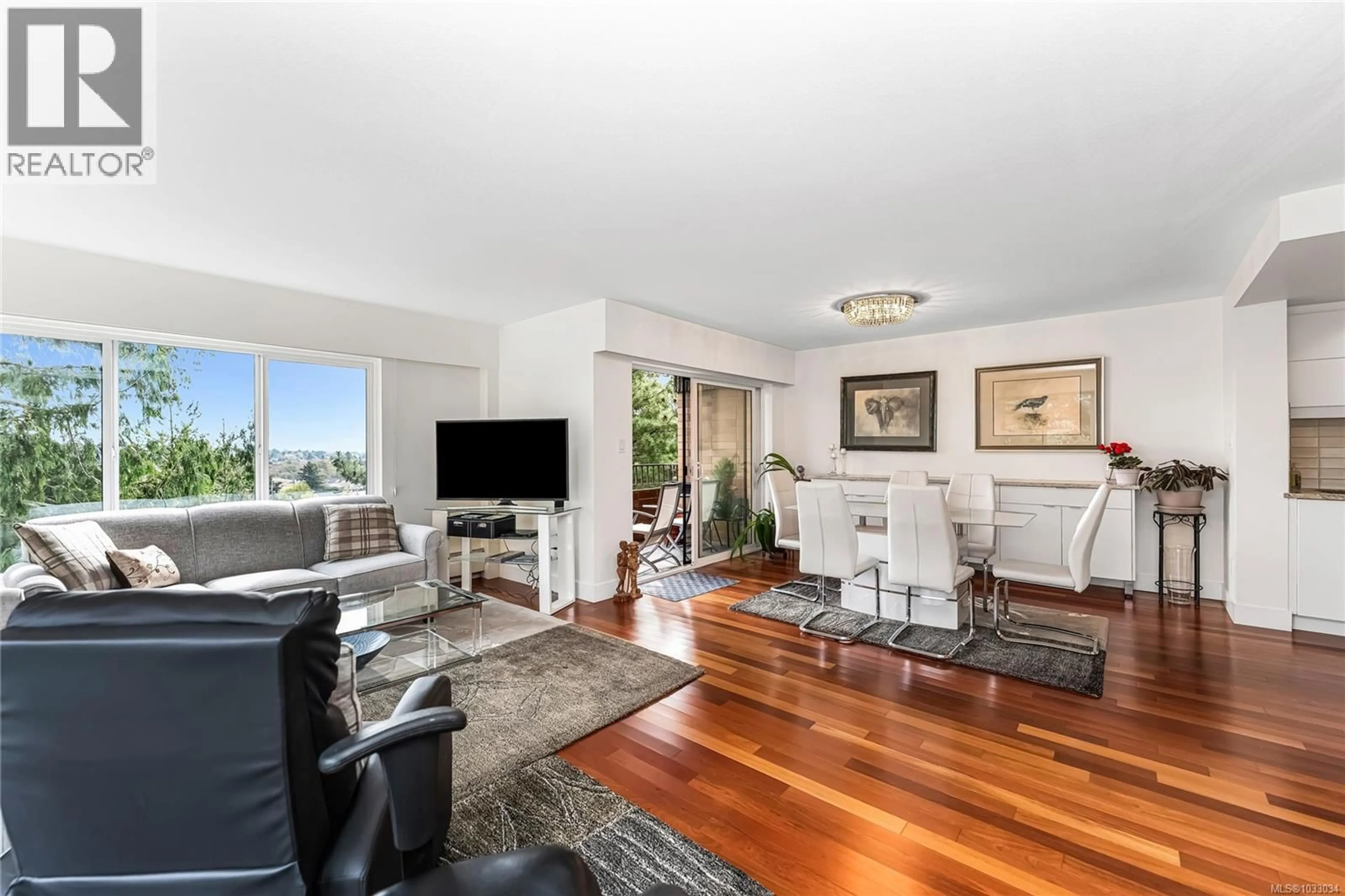 Living room with furniture, wood/laminate floor for 205 - 2910 COOK STREET, Victoria British Columbia V8T3S7