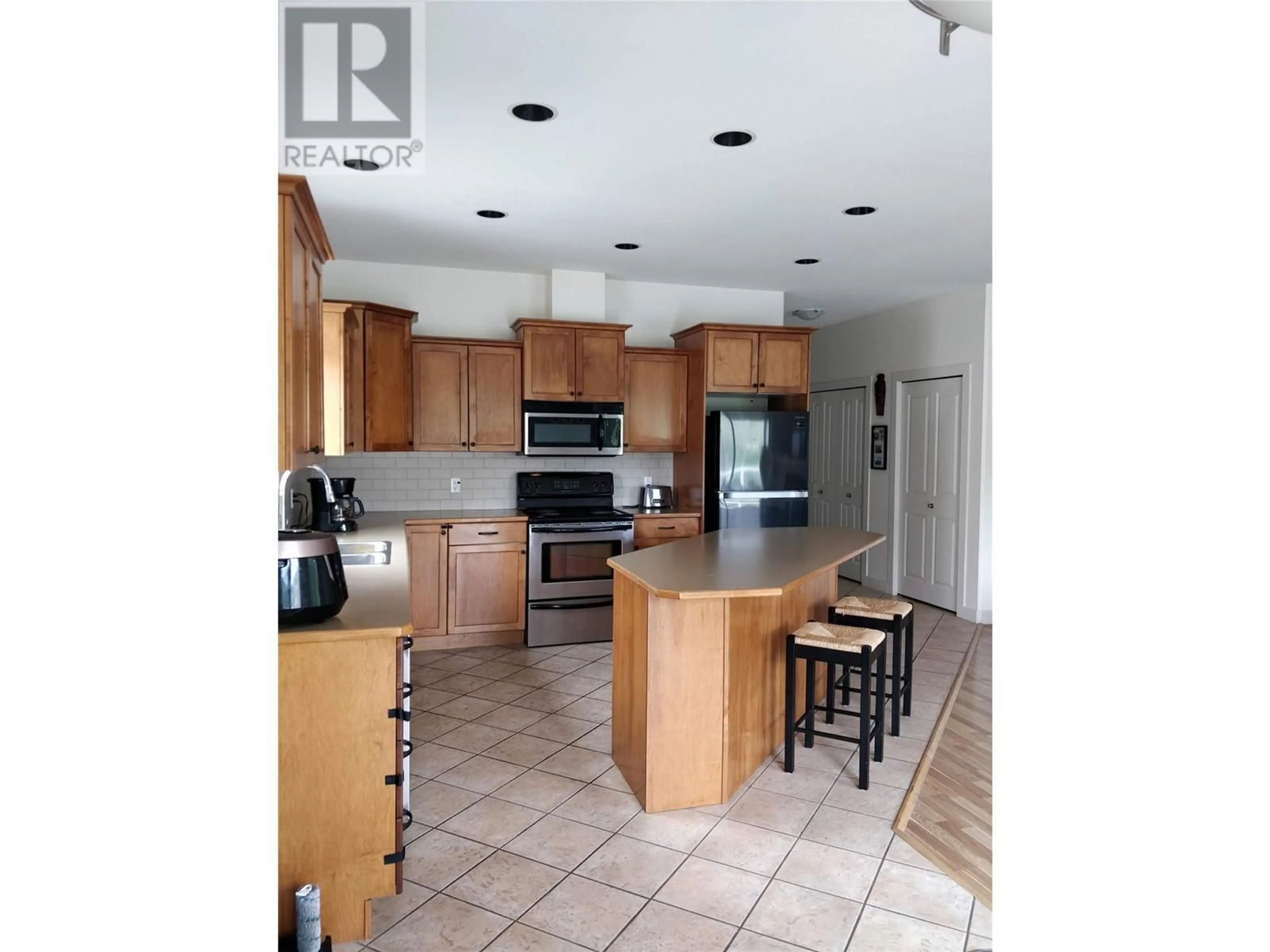 Open concept kitchen, unknown for 4009 Okanagan Avenue, Vernon British Columbia V1T1K8