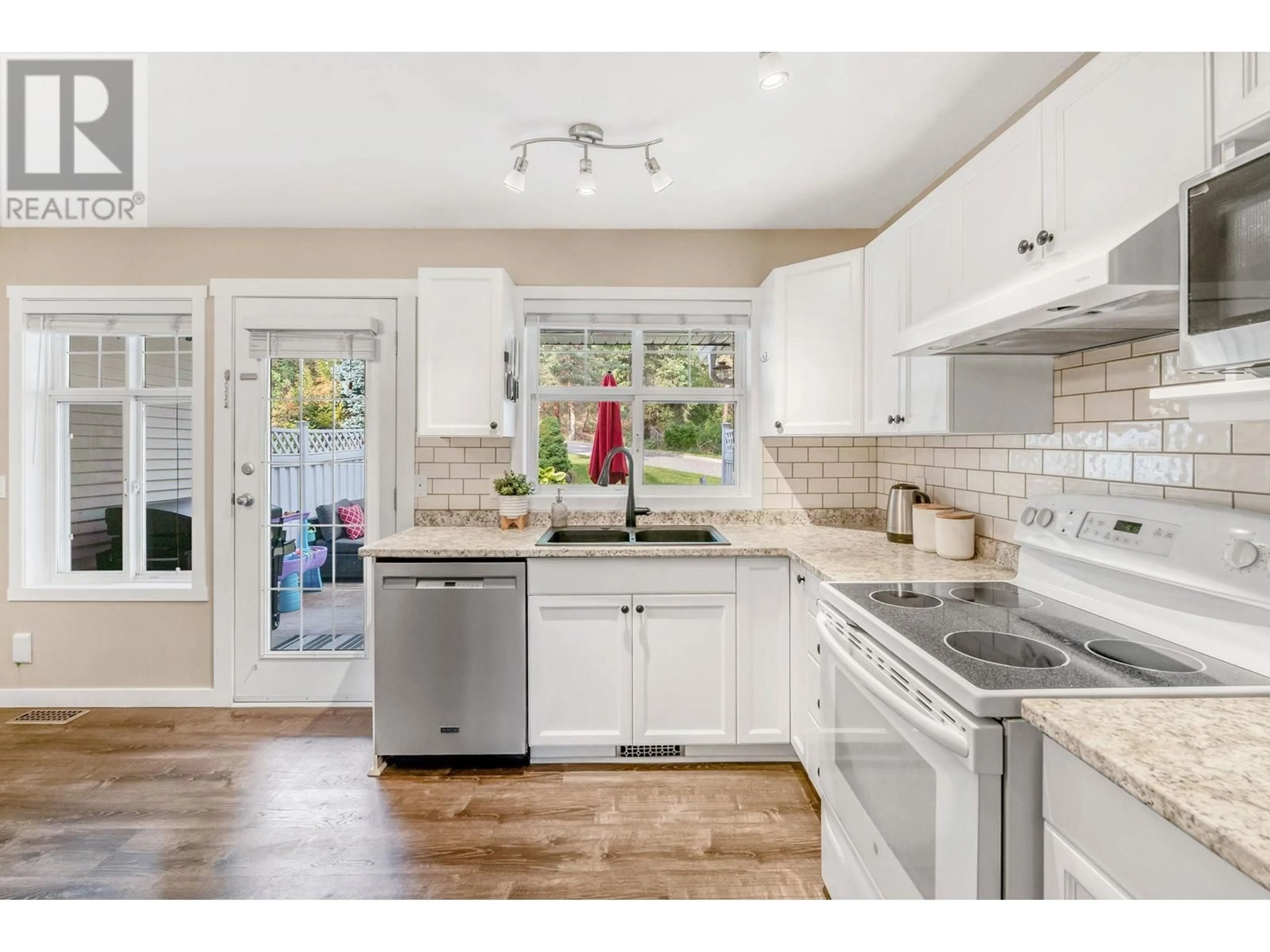 Open concept kitchen, ceramic/tile floor for 102 3825 Glen Canyon Drive, West Kelowna British Columbia V4T2T4