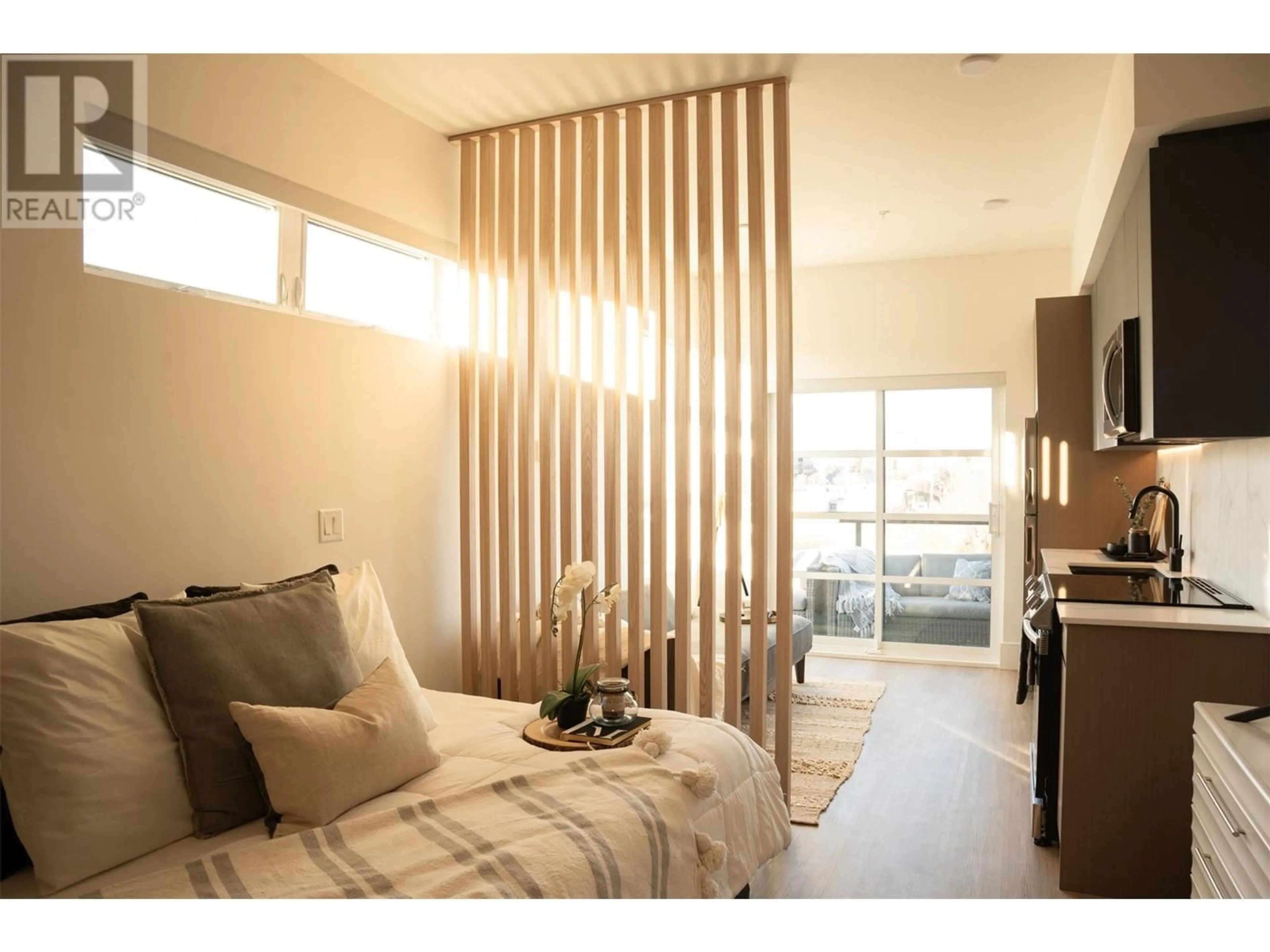 Bedroom with bed, wood/laminate floor for 720 K.L.O. Road Unit# 518 Lot# 93, Kelowna British Columbia V1Y0M9