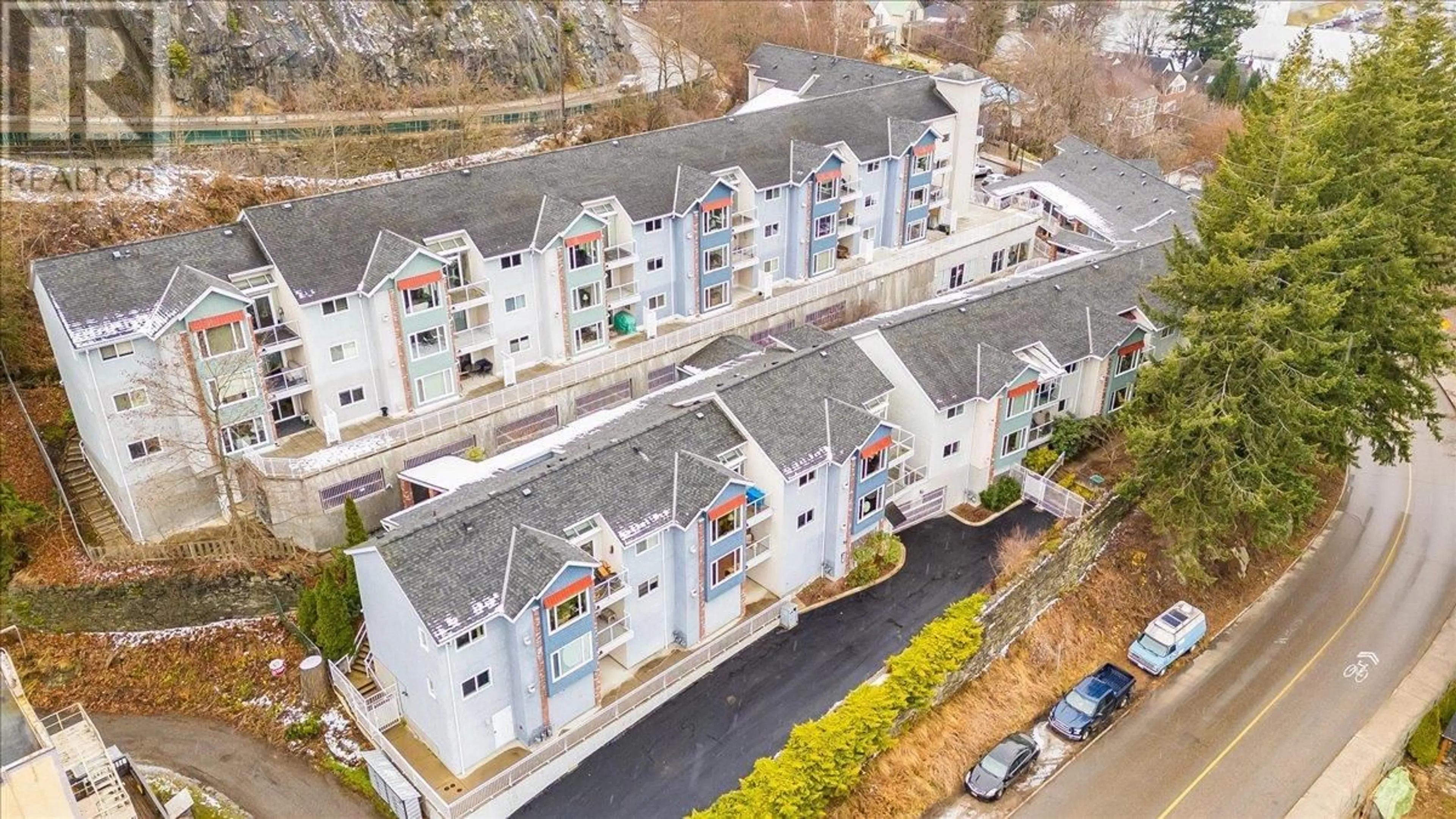 A pic from outside/outdoor area/front of a property/back of a property/a pic from drone, city buildings view from balcony for 38 High Street Unit# 27, Nelson British Columbia V1L6E7