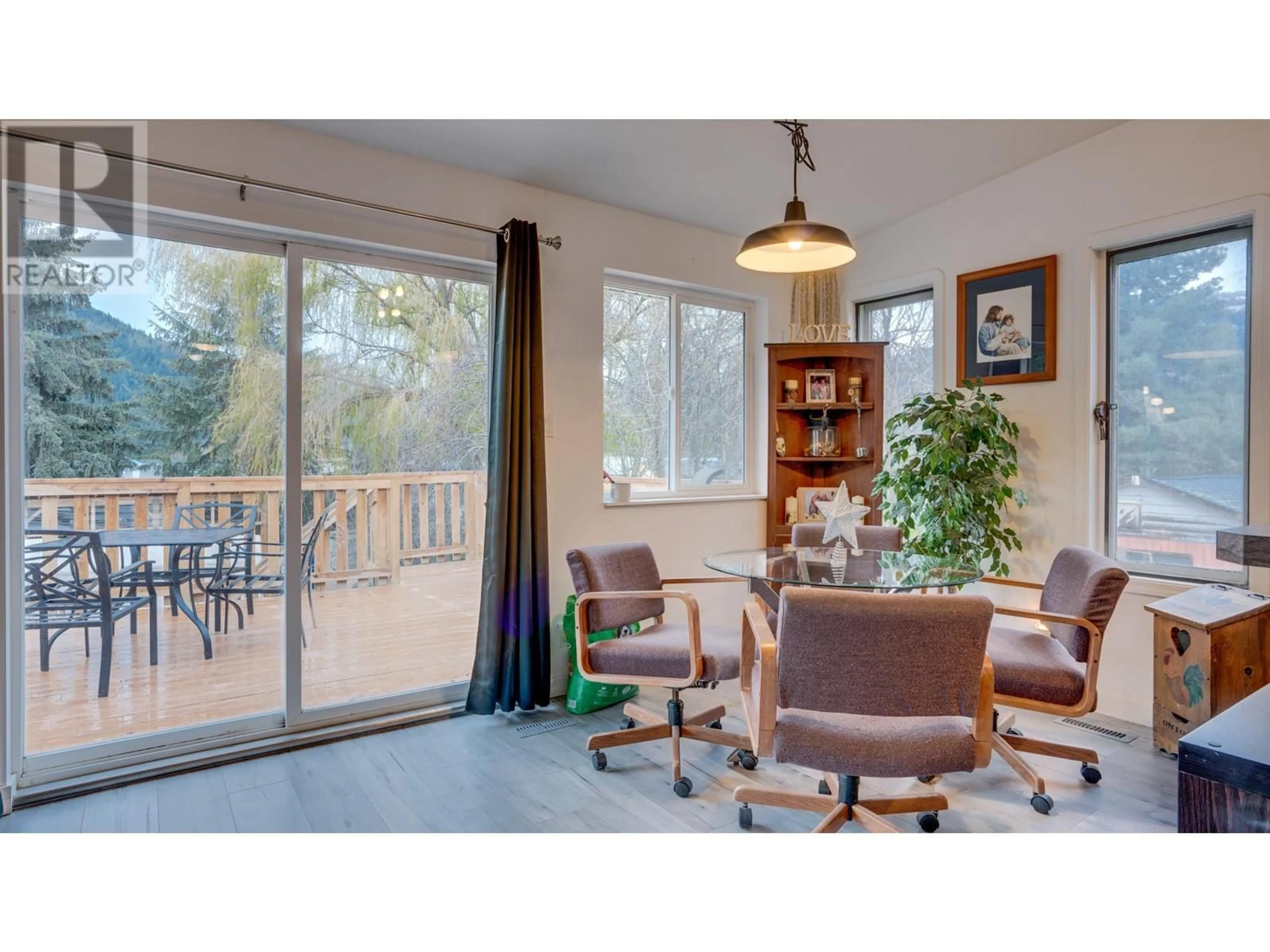 Living room with furniture, wood/laminate floor for 434 Maduik Avenue, Sicamous British Columbia V0E2V1