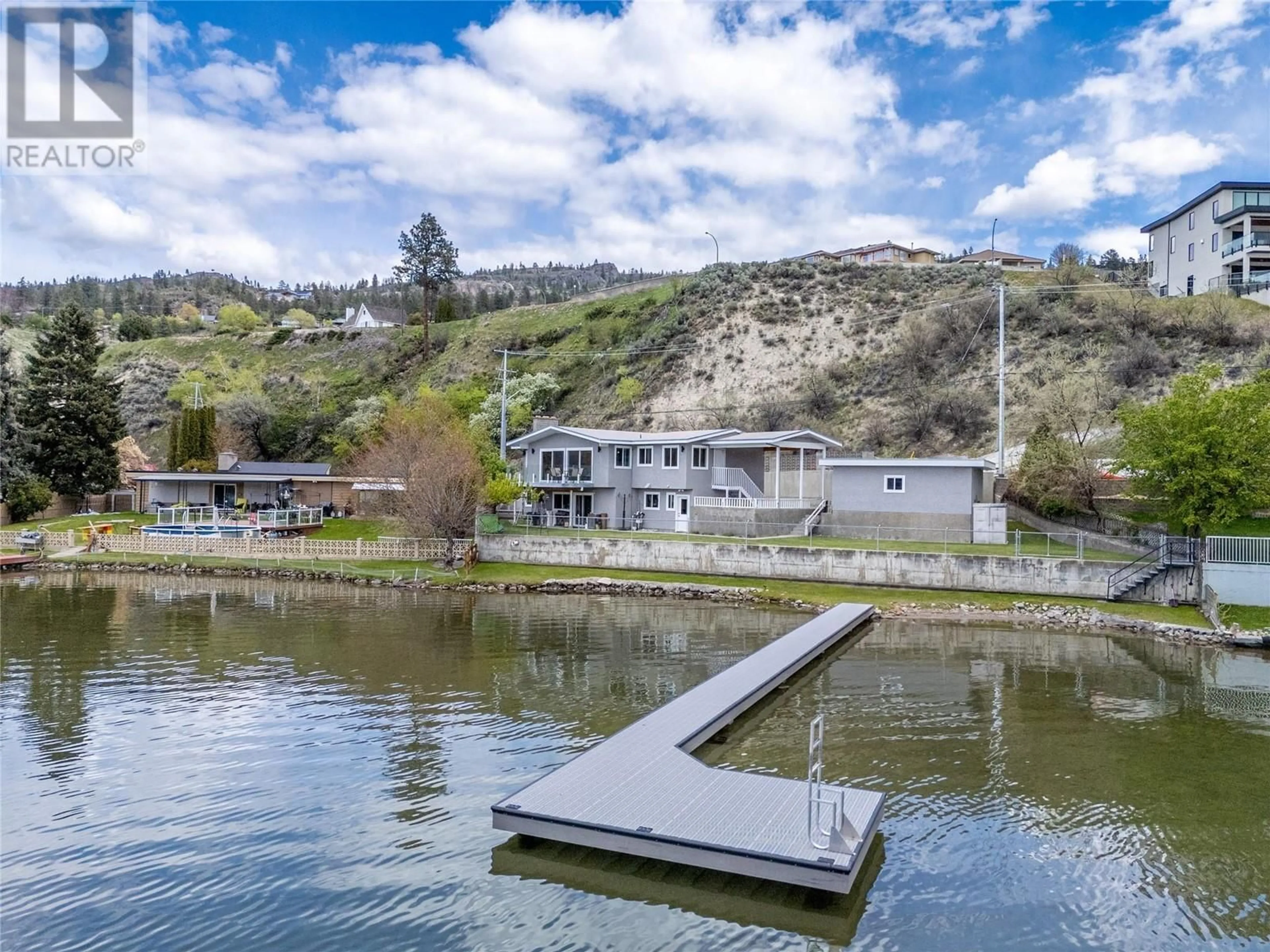 A pic from outside/outdoor area/front of a property/back of a property/a pic from drone, water/lake/river/ocean view for 3951 Lakeside Road, Penticton British Columbia V2A8W3