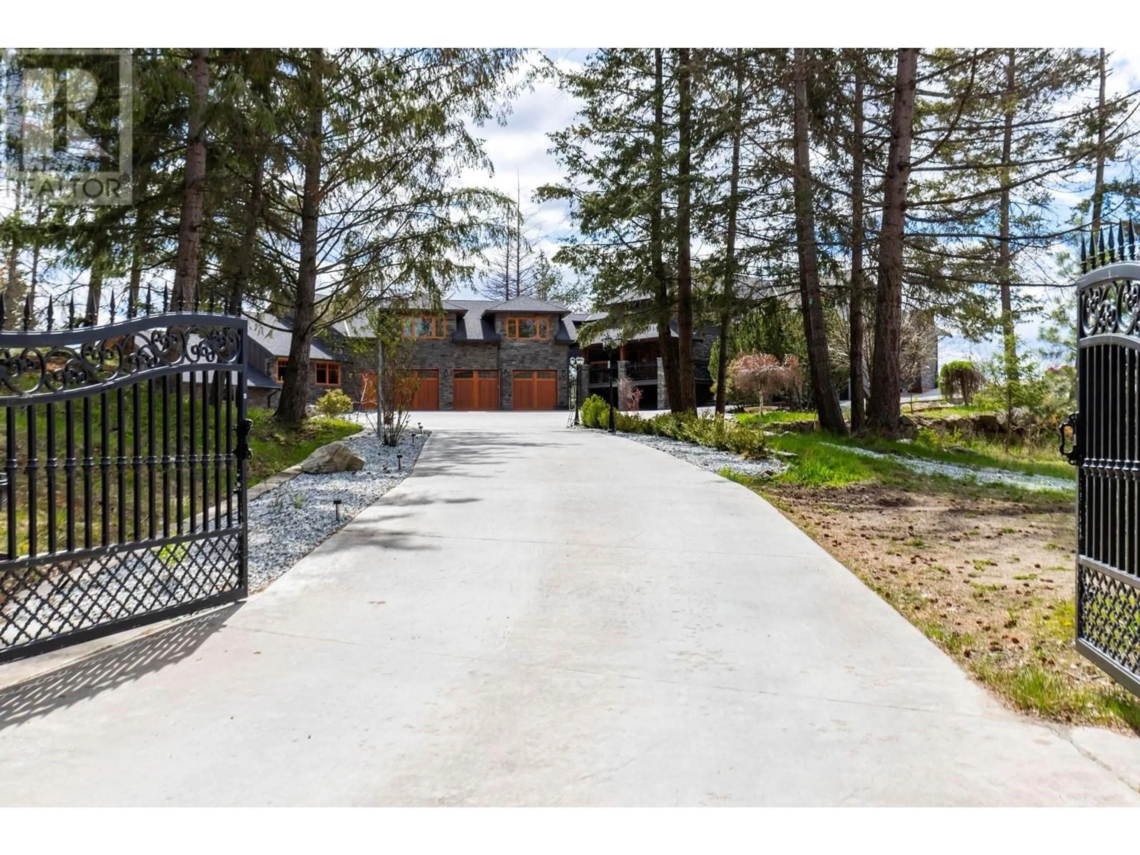 A pic from outside/outdoor area/front of a property/back of a property/a pic from drone, street for 5774 DEADPINE DRIVE, Kelowna British Columbia V1P1A3