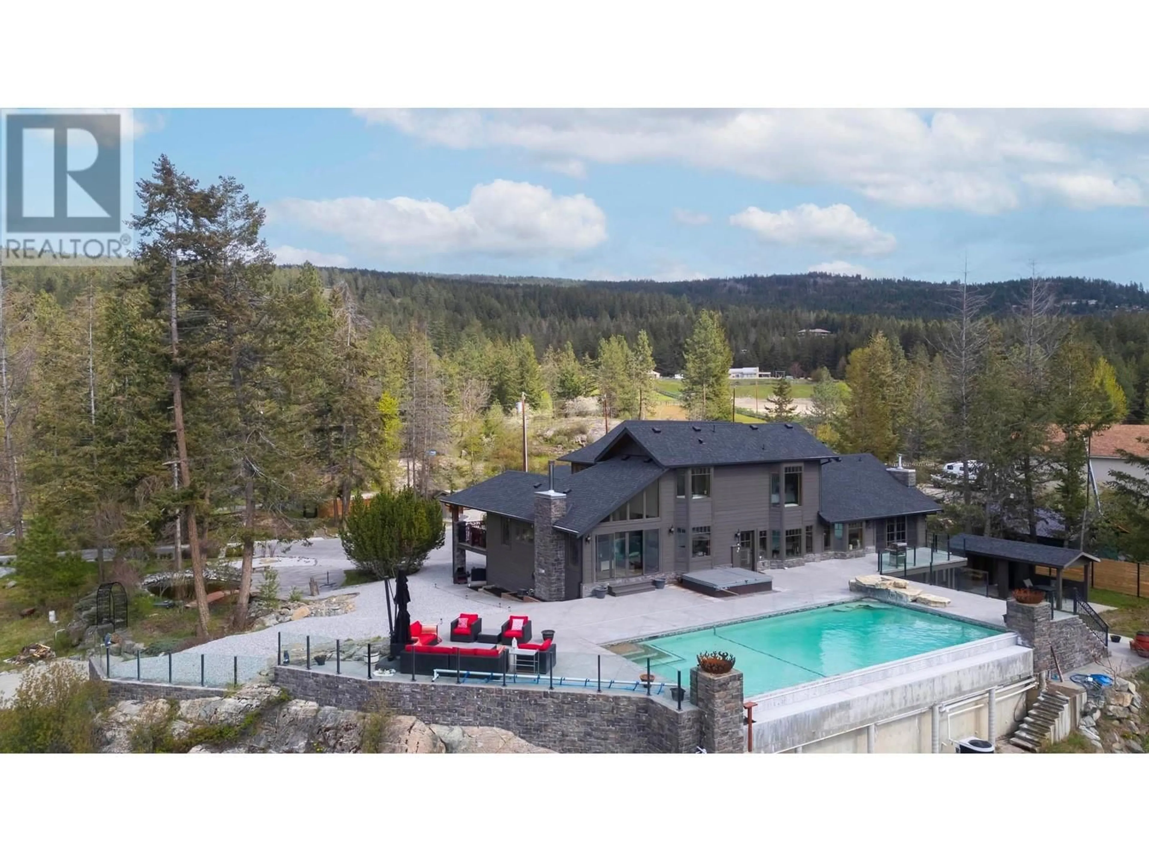 A pic from outside/outdoor area/front of a property/back of a property/a pic from drone, mountain view for 5774 DEADPINE DRIVE, Kelowna British Columbia V1P1A3