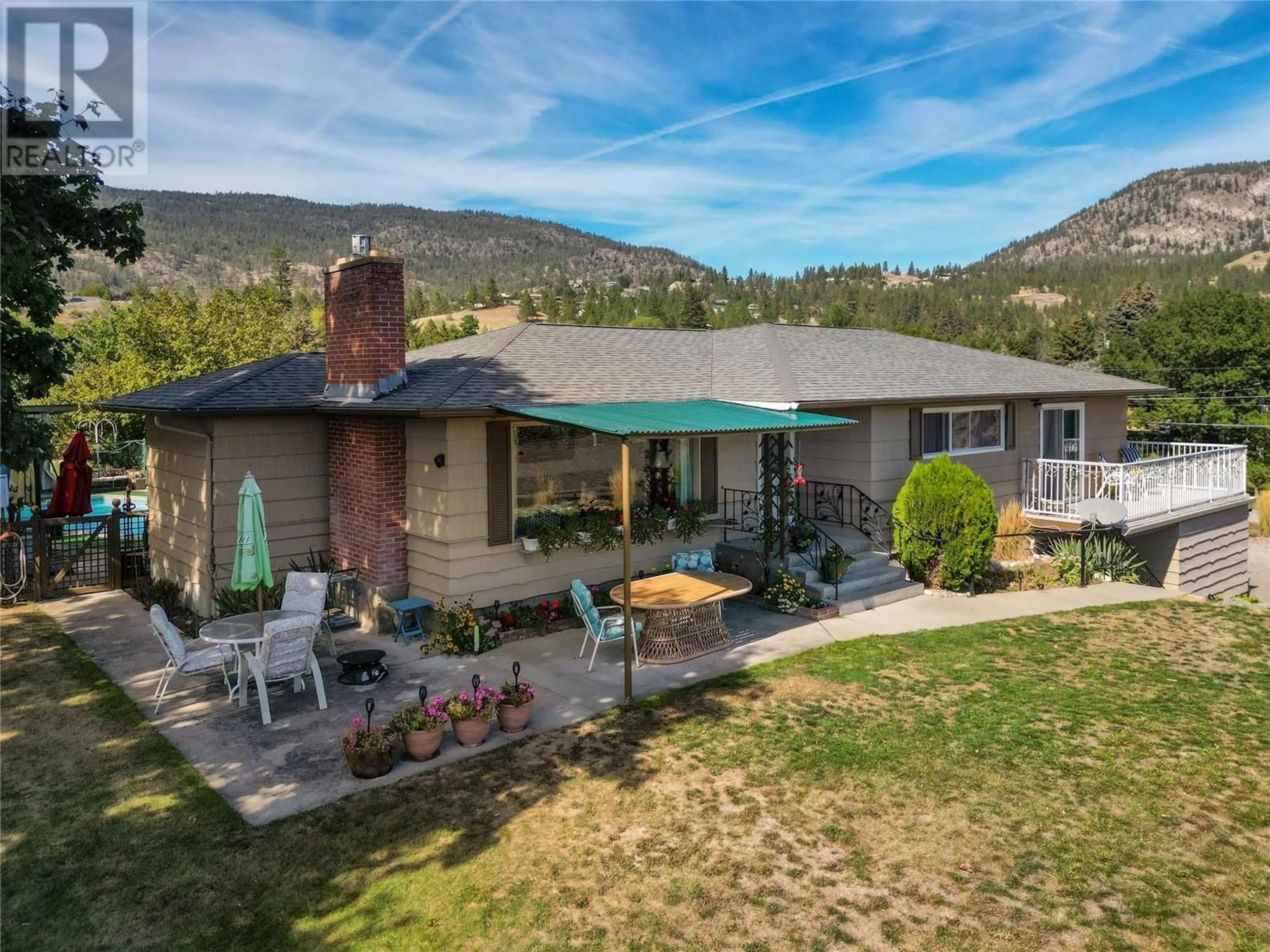 A pic from outside/outdoor area/front of a property/back of a property/a pic from drone, mountain view for 903 Newton Drive, Penticton British Columbia V2A8Z4