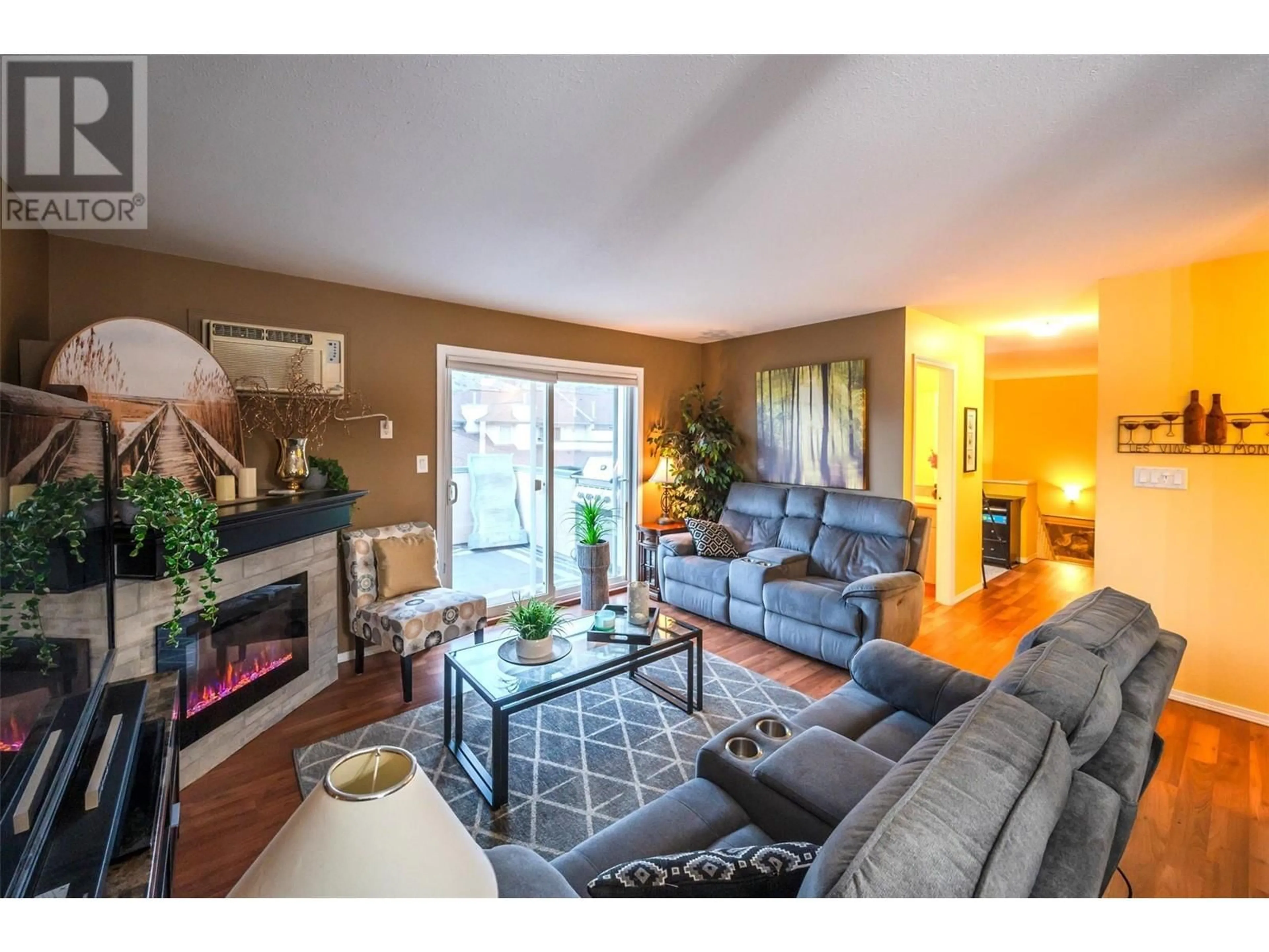 Living room with furniture, wood/laminate floor for 6514 Meadows Drive Unit# 20, Oliver British Columbia V0H1T3