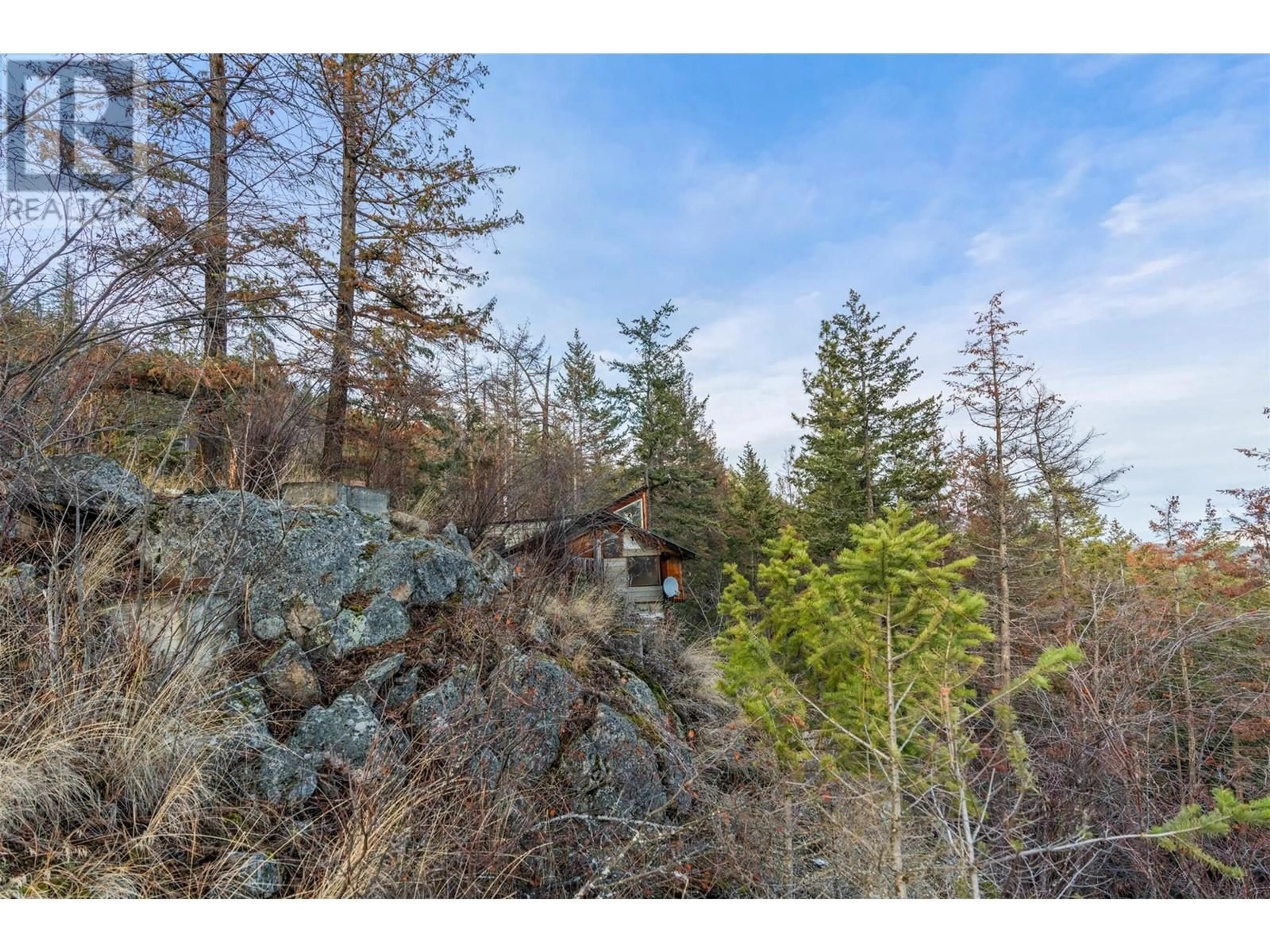 A pic from outside/outdoor area/front of a property/back of a property/a pic from drone, forest/trees view for 9357 Winchester Road Lot# LOT 11, Vernon British Columbia V1H2E1