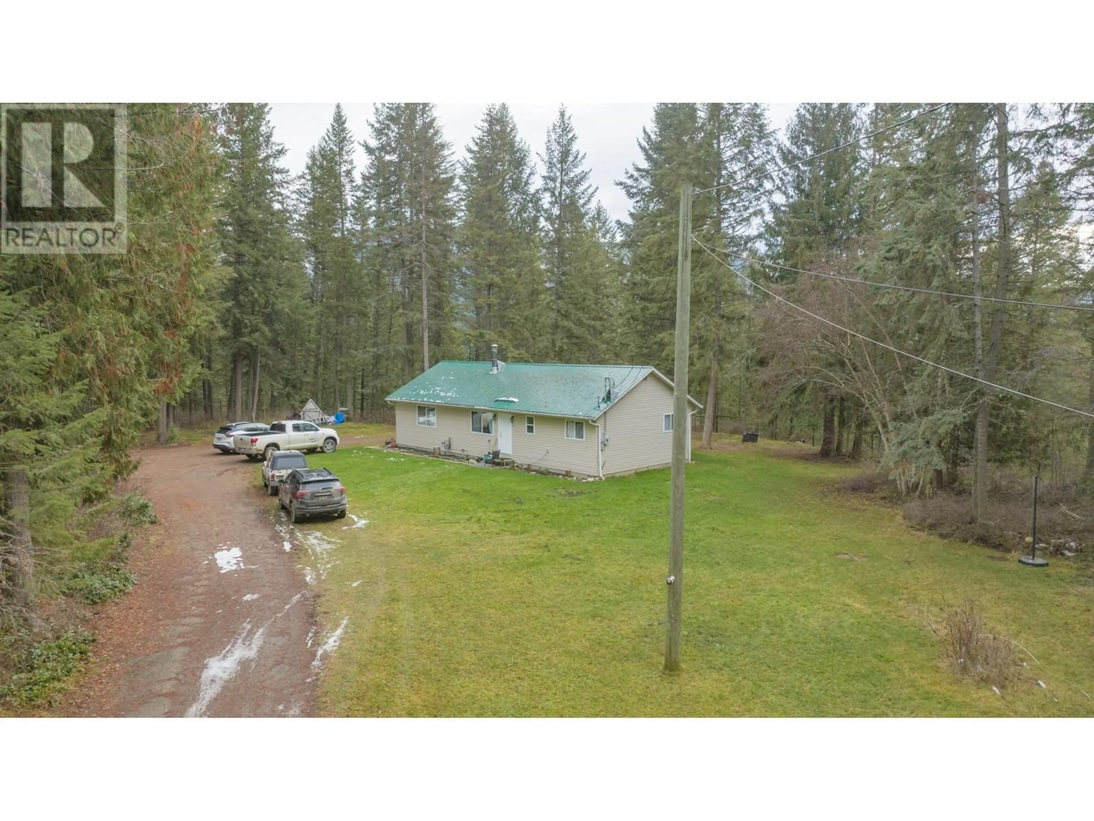 A pic from outside/outdoor area/front of a property/back of a property/a pic from drone, forest/trees view for 398 Albers Road, Lumby British Columbia V0E2G5