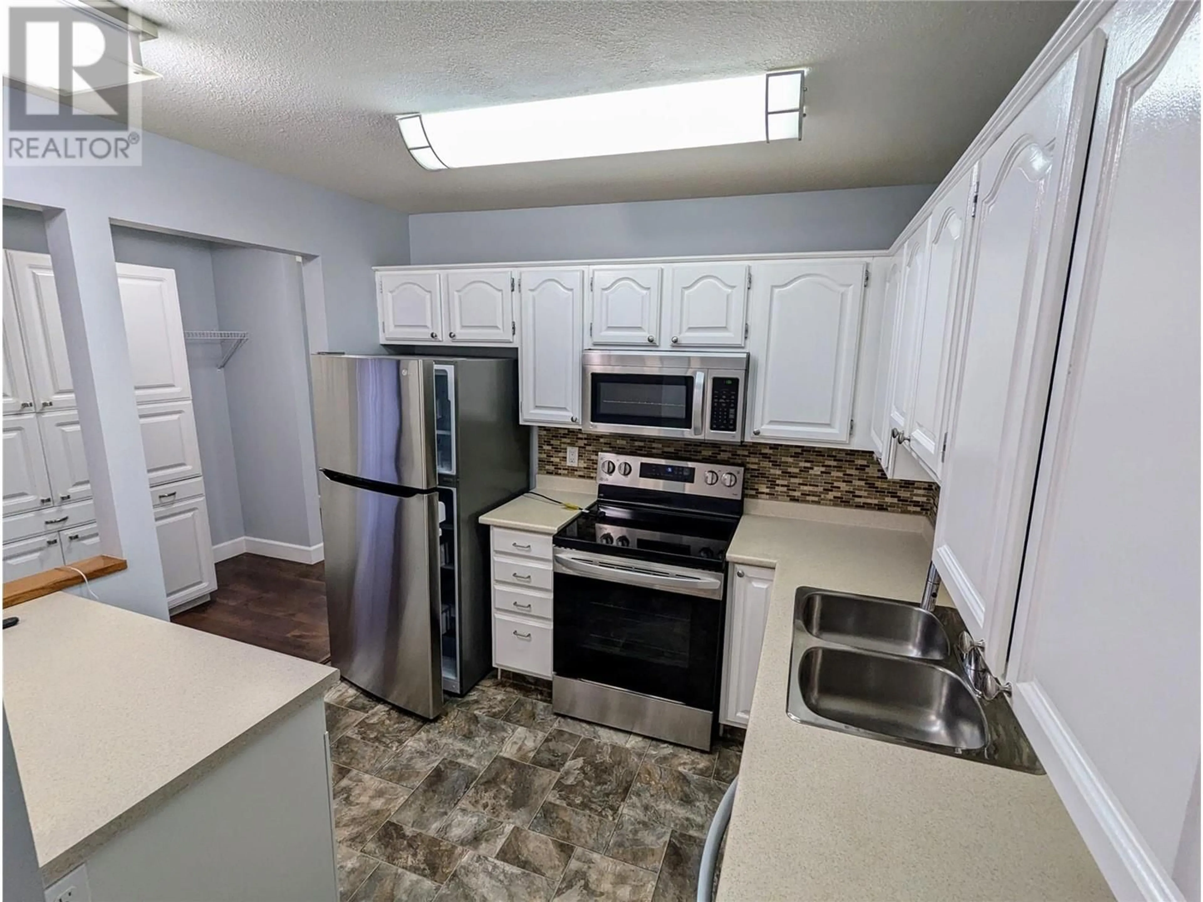 Standard kitchen, unknown for 1610 Gordon Drive Unit# 206, Kelowna British Columbia V1Y3G9