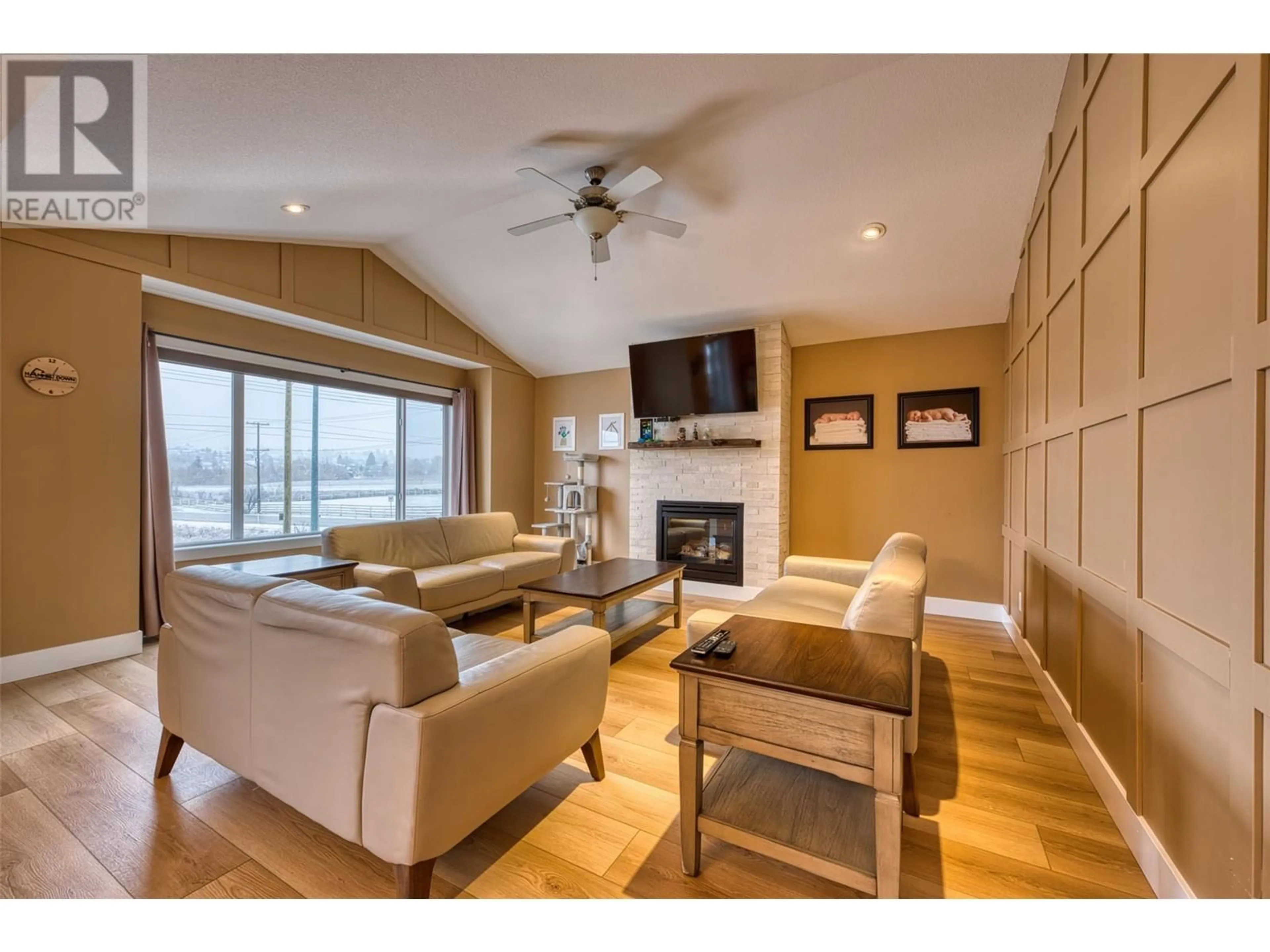 Living room with furniture, wood/laminate floor for 1501 15th Avenue, Vernon British Columbia V1T9R4