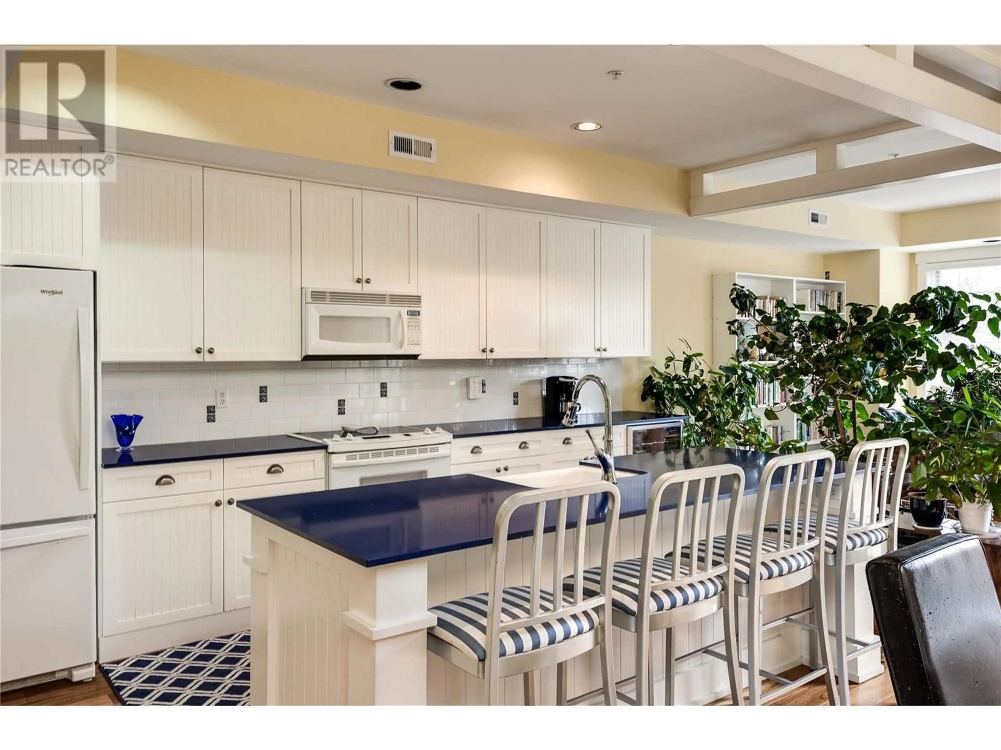 Open concept kitchen, ceramic/tile floor for 524 - 3880 TRUSWELL ROAD, Kelowna British Columbia V1W5A2