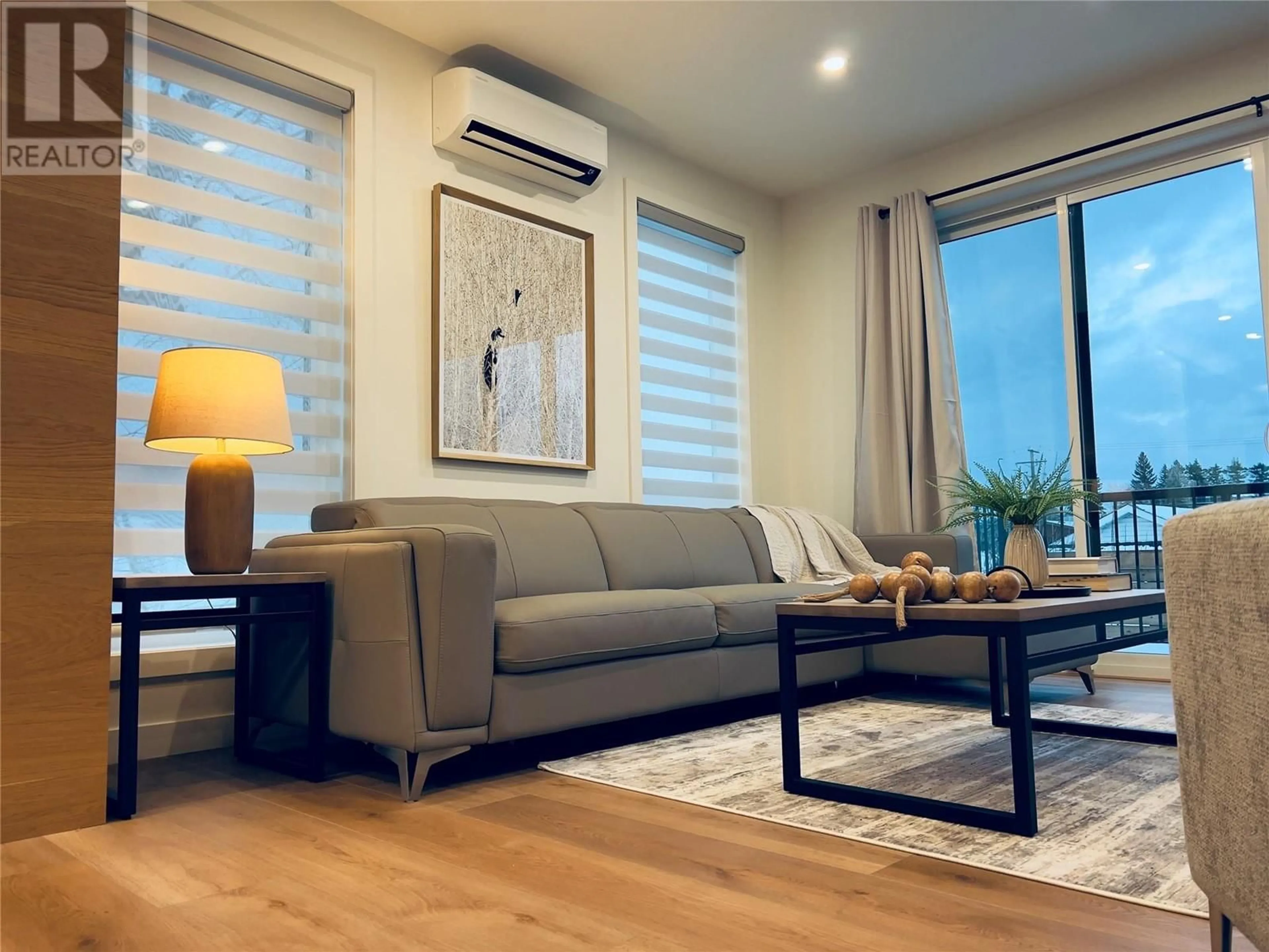 Living room with furniture, wood/laminate floor for 402 - 510 14TH STREET, Invermere British Columbia V0A1K0