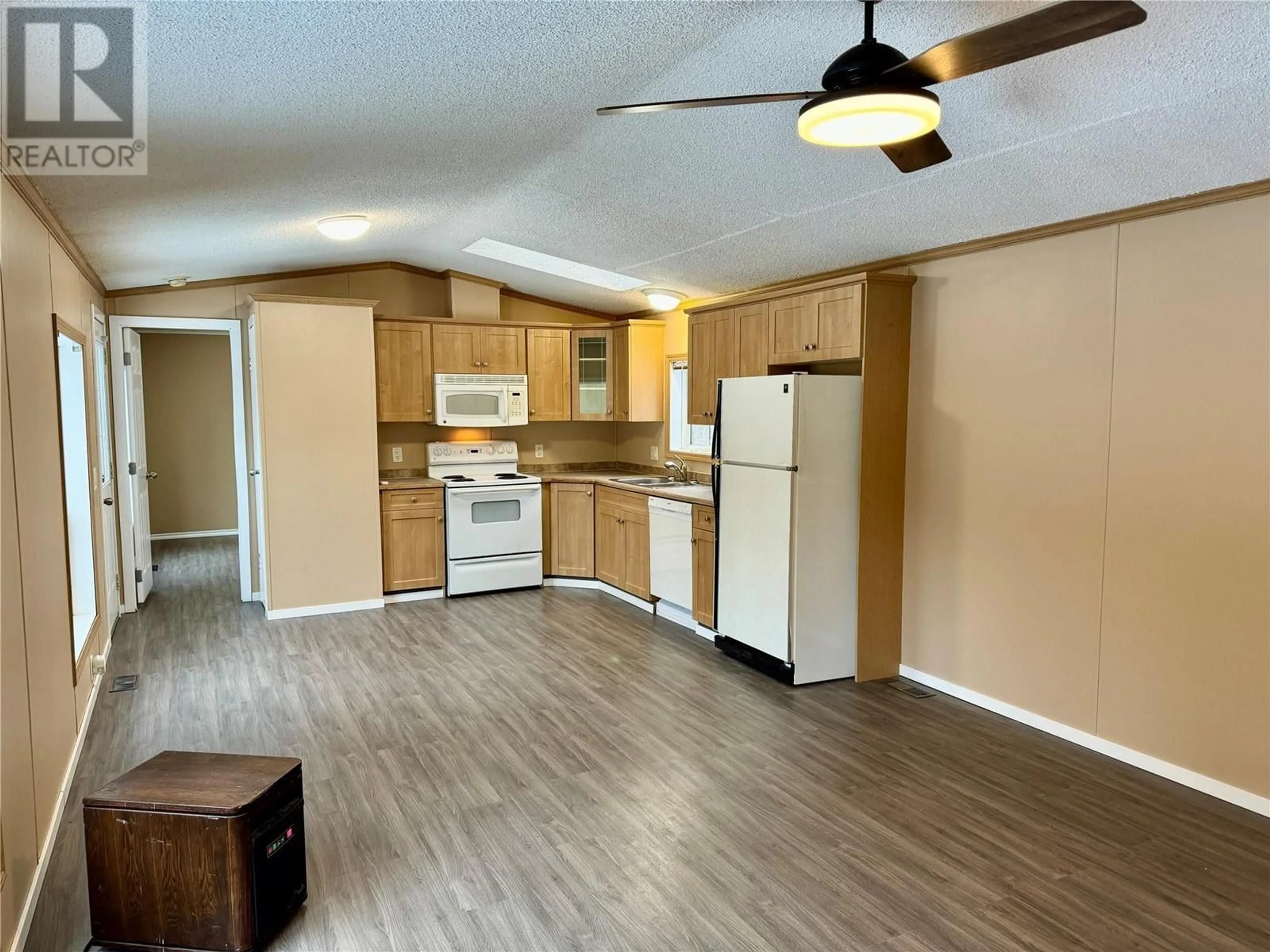 Open concept kitchen, wood/laminate floor for 4650 Cunningham Frontage Road Unit# 3, Malakwa British Columbia V0E2J0