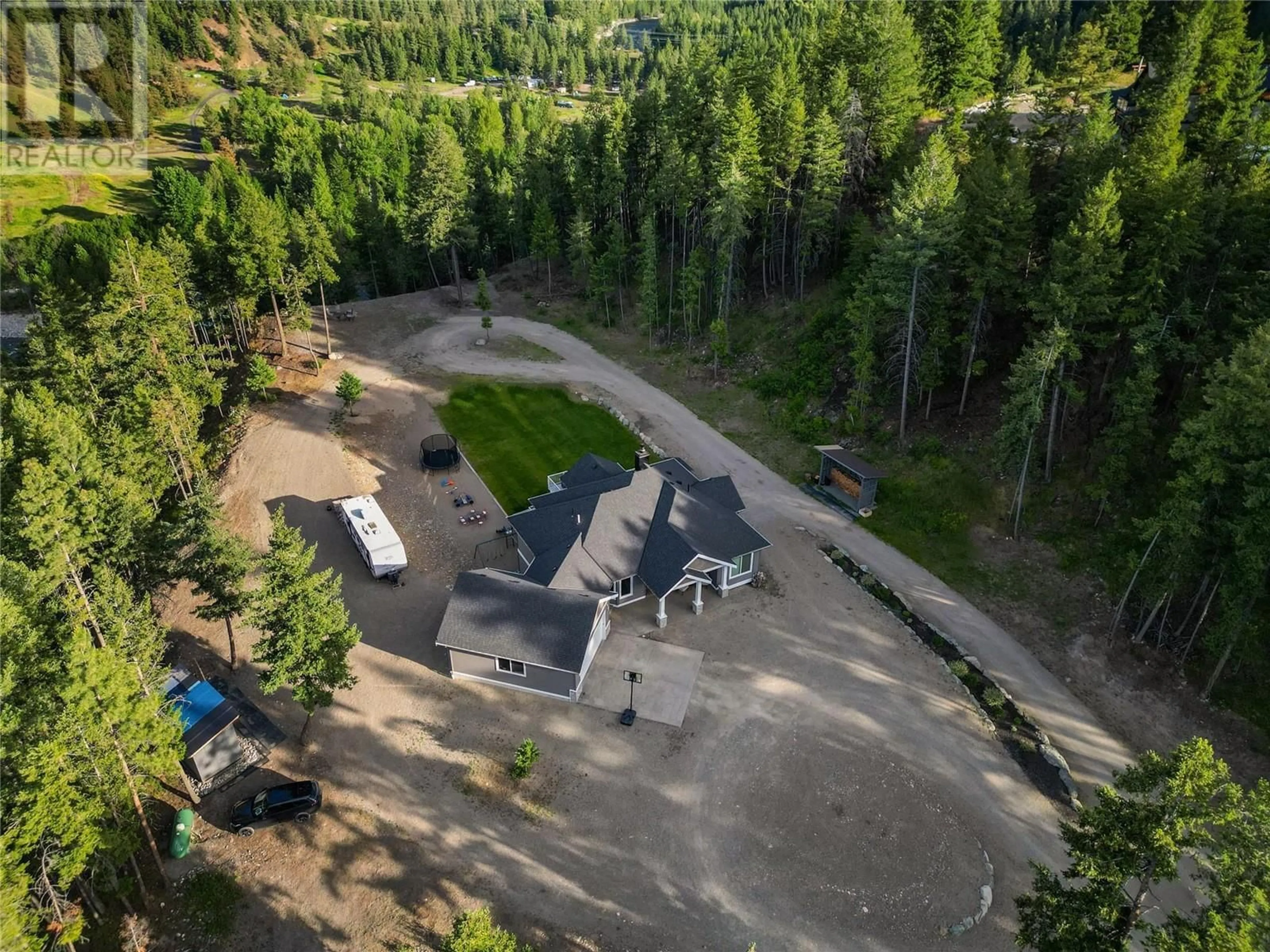 A pic from outside/outdoor area/front of a property/back of a property/a pic from drone, forest/trees view for 2-640 HWY 3, Princeton British Columbia V0X1W0