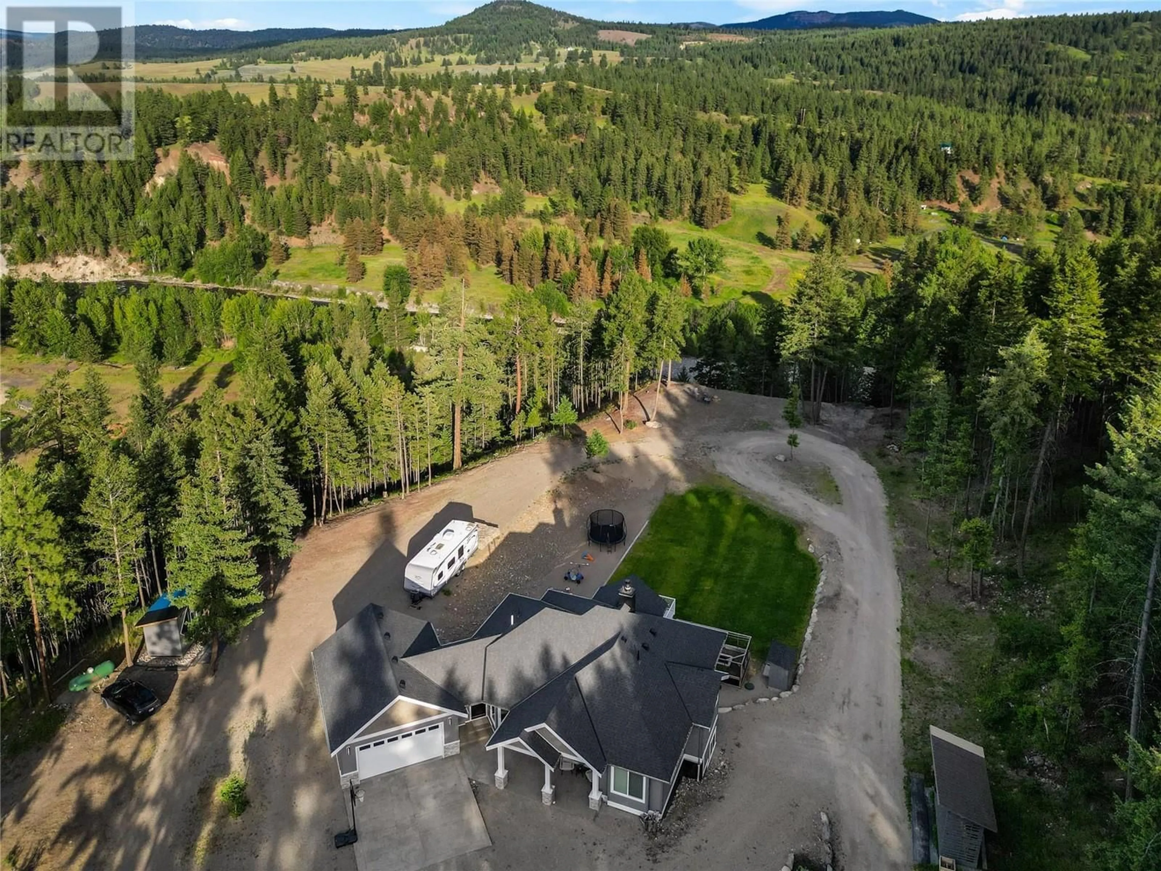 A pic from outside/outdoor area/front of a property/back of a property/a pic from drone, forest/trees view for 2-640 HWY 3, Princeton British Columbia V0X1W0