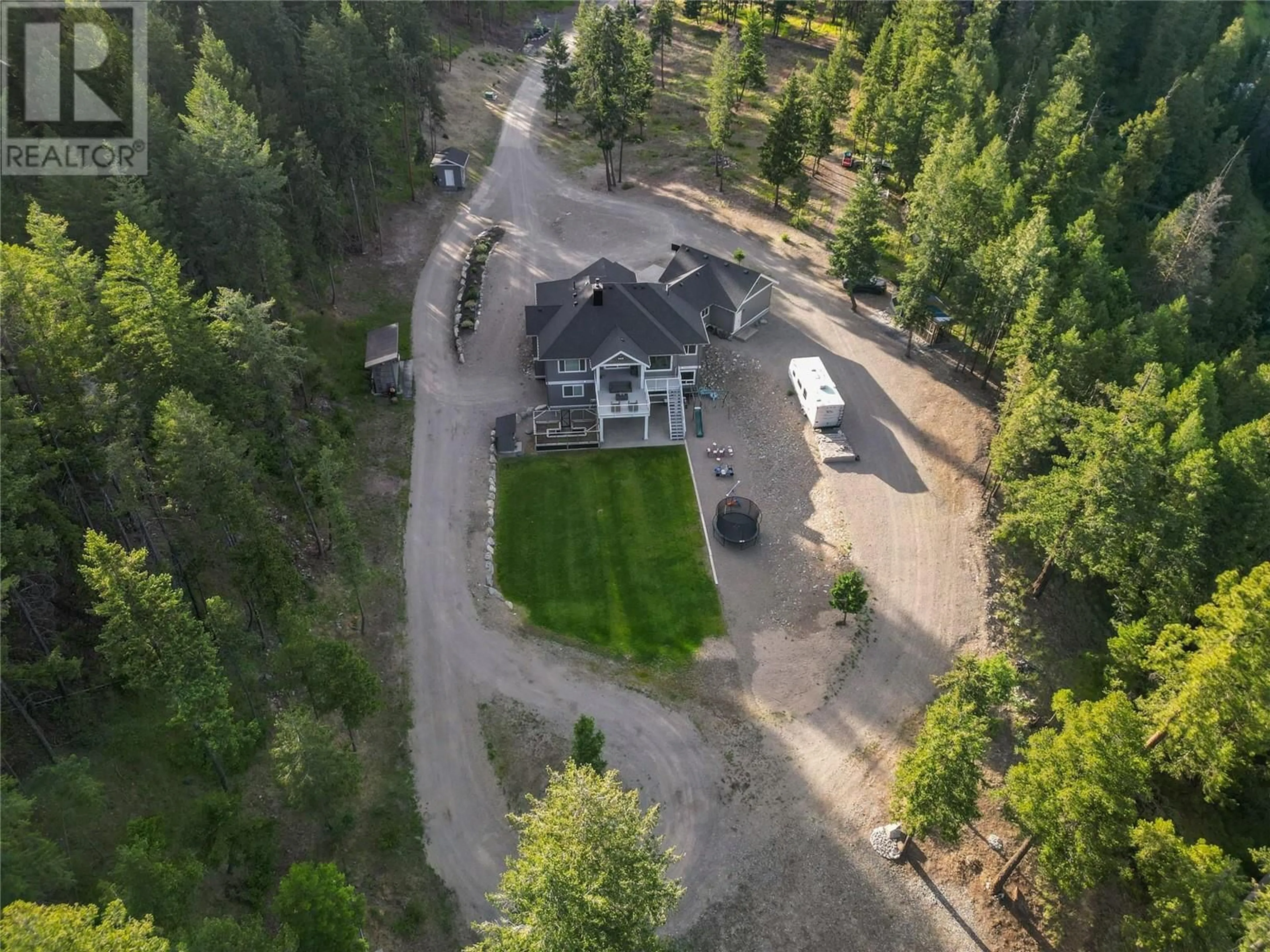 A pic from outside/outdoor area/front of a property/back of a property/a pic from drone, forest/trees view for 2-640 HWY 3, Princeton British Columbia V0X1W0