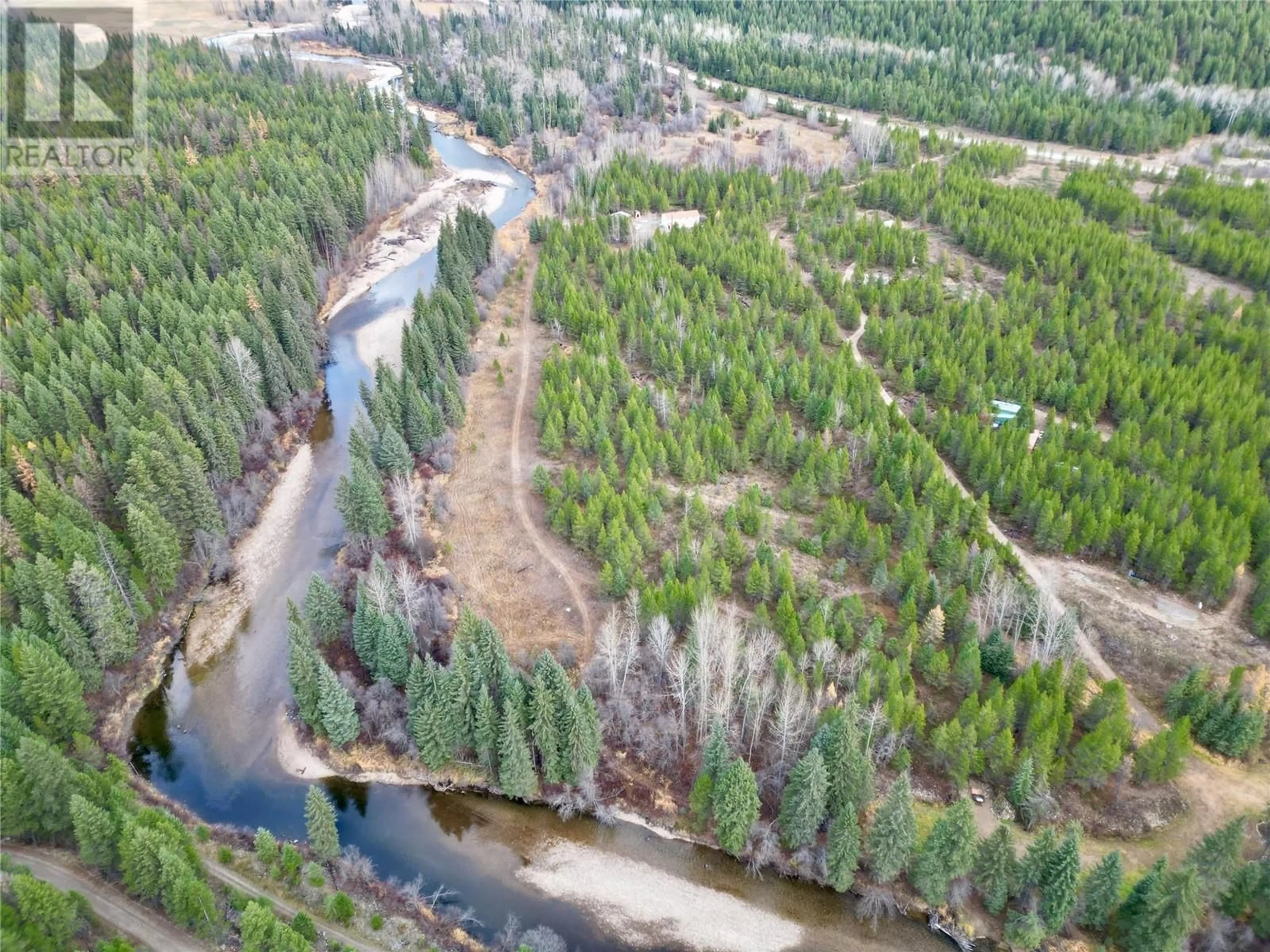 A pic from outside/outdoor area/front of a property/back of a property/a pic from drone, forest/trees view for 5385 Highway 33, Beaverdell British Columbia V0H1A0