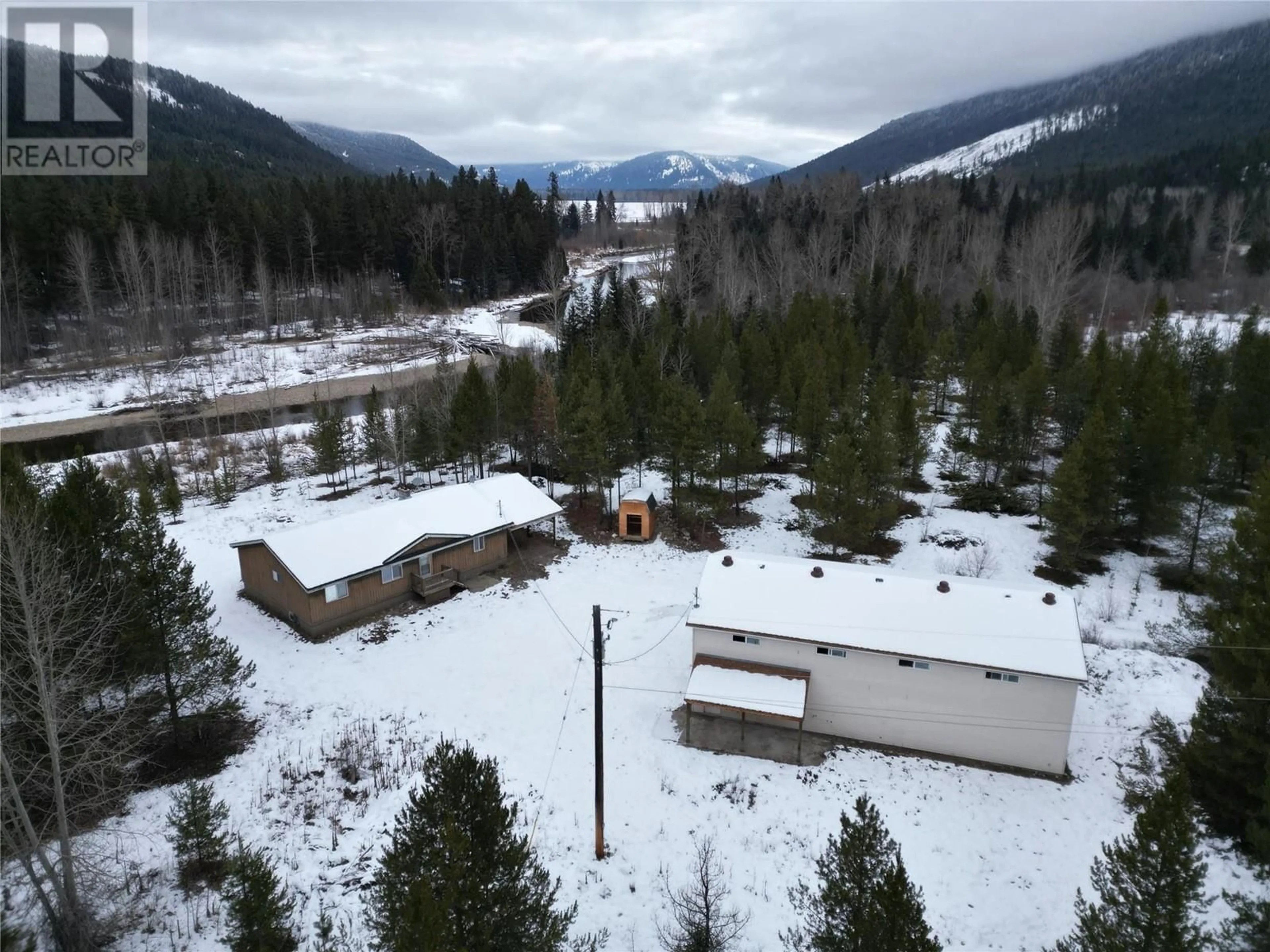 A pic from outside/outdoor area/front of a property/back of a property/a pic from drone, mountain view for 5385 Highway 33, Beaverdell British Columbia V0H1A0