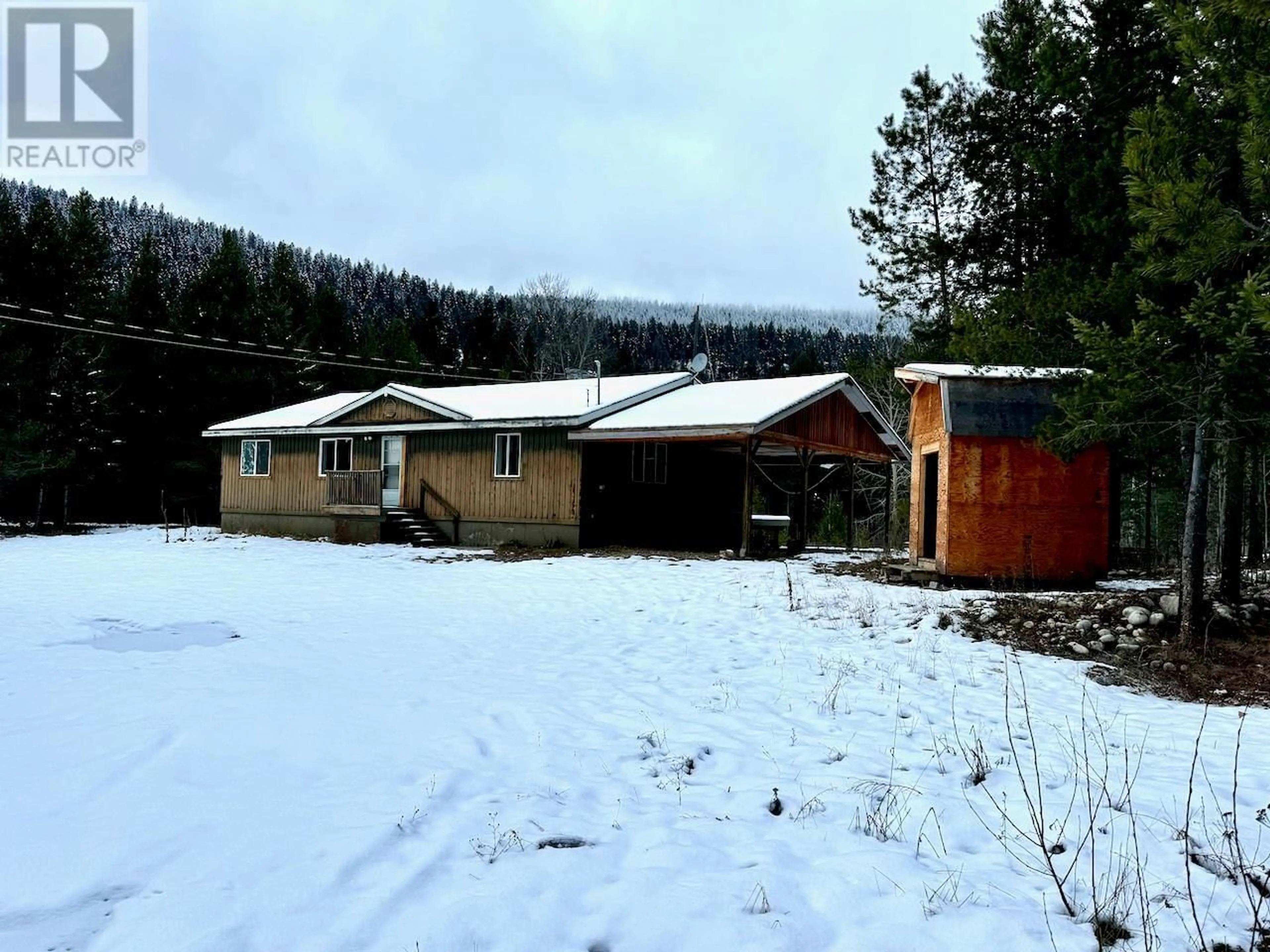 A pic from outside/outdoor area/front of a property/back of a property/a pic from drone, mountain view for 5385 Highway 33, Beaverdell British Columbia V0H1A0