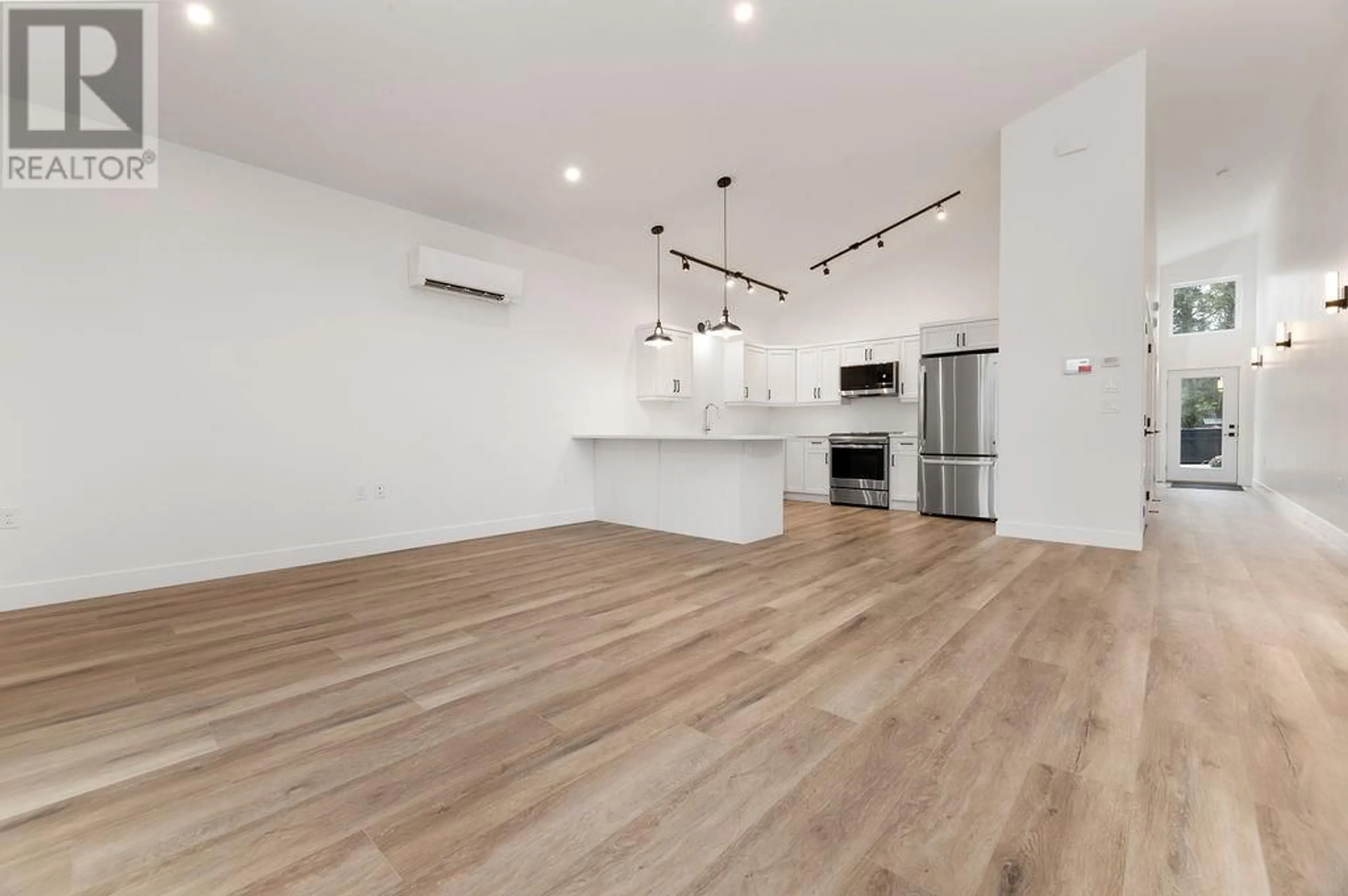 Open concept kitchen, wood/laminate floor for 1306 ORCHARD LANE, Invermere British Columbia V0A1K4