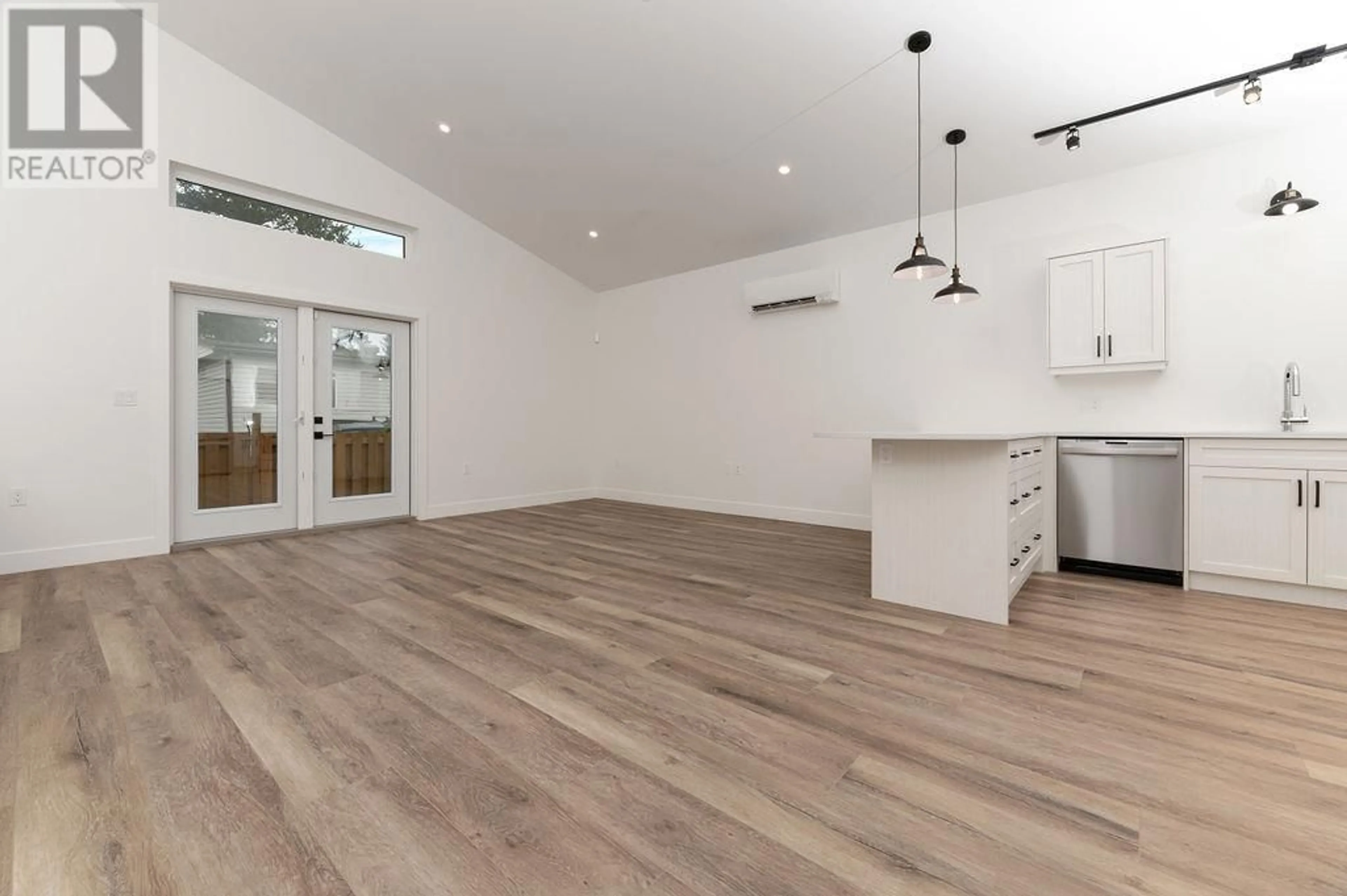 Open concept kitchen, wood/laminate floor for 1304 ORCHARD LANE, Invermere British Columbia V0A1K4