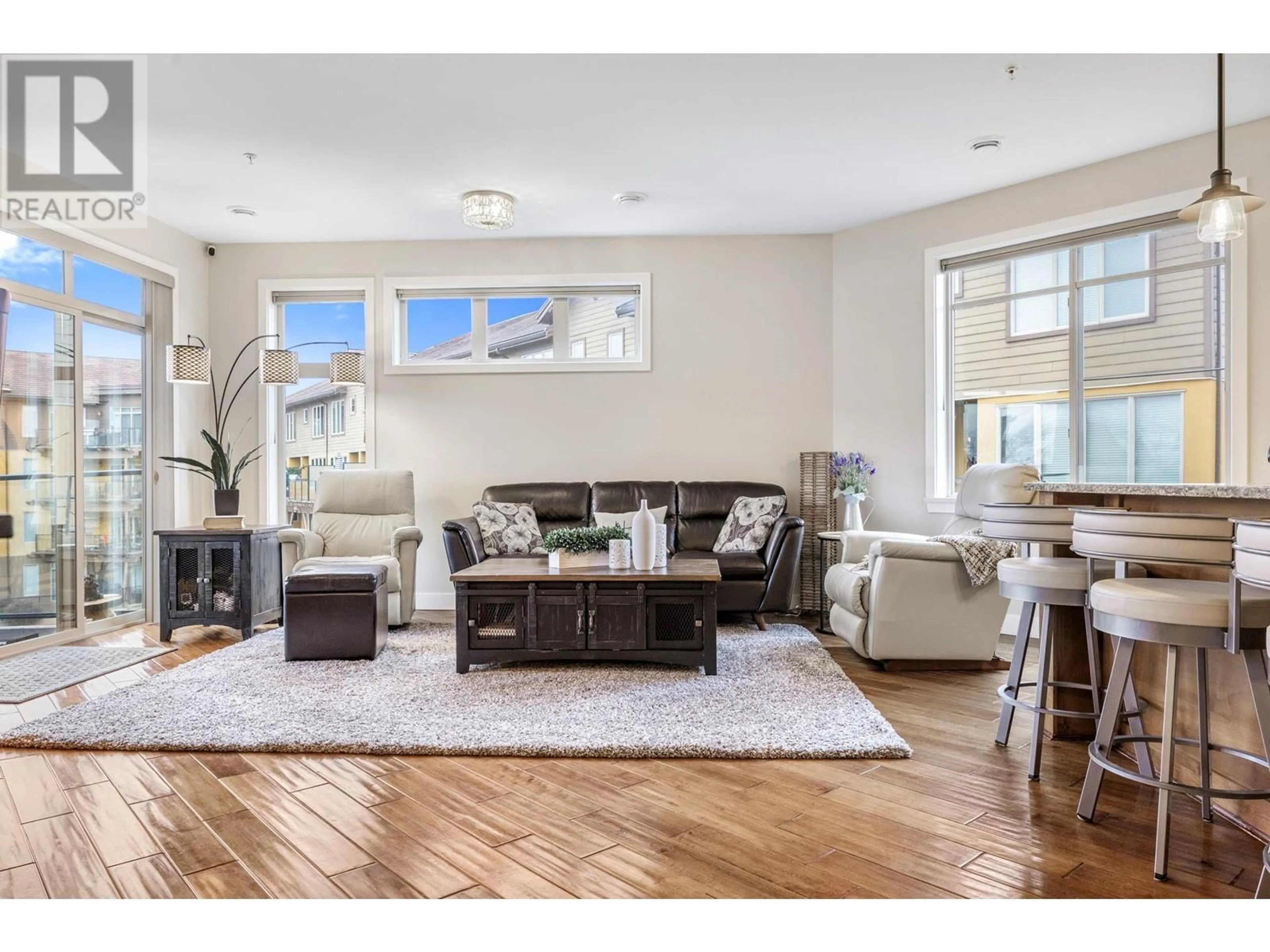 Living room with furniture, wood/laminate floor for 4026 Pritchard Drive Unit# 6304, West Kelowna British Columbia V4T3E4