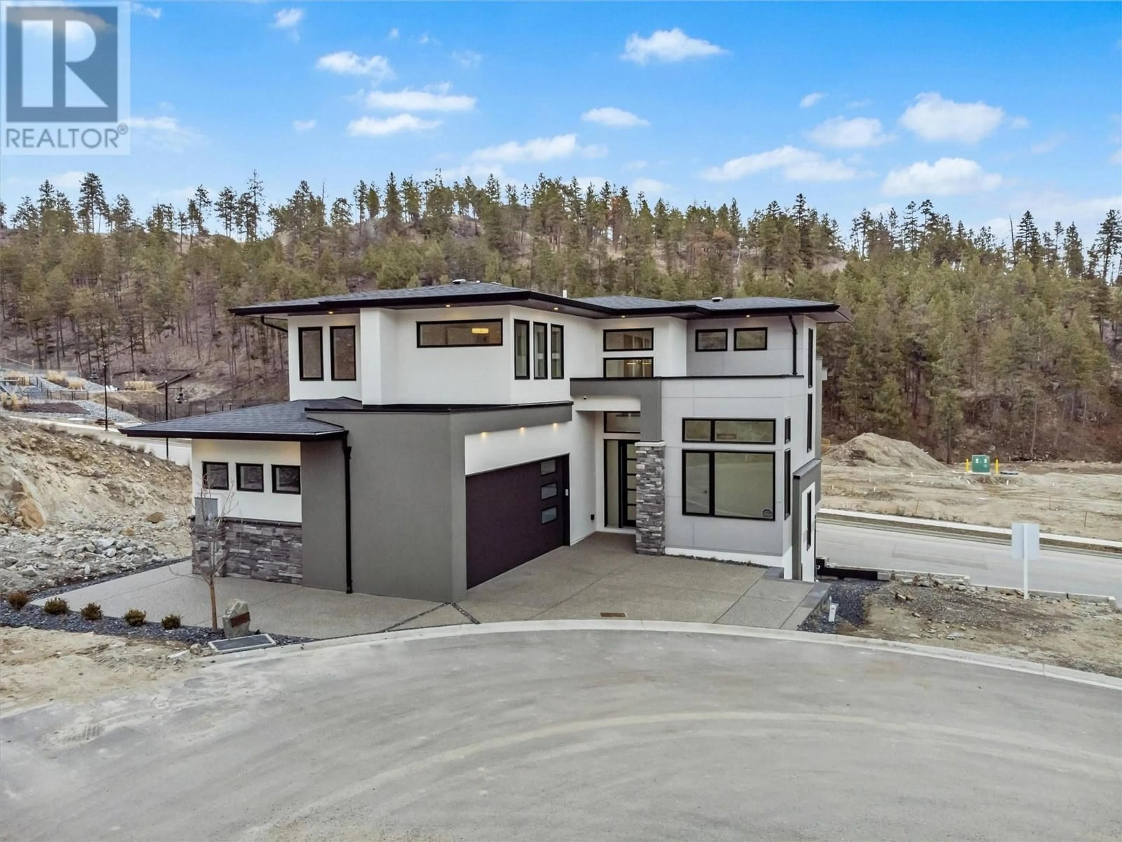 A pic from outside/outdoor area/front of a property/back of a property/a pic from drone, unknown for 3462 Hilltown Close, Kelowna British Columbia V1V0H4