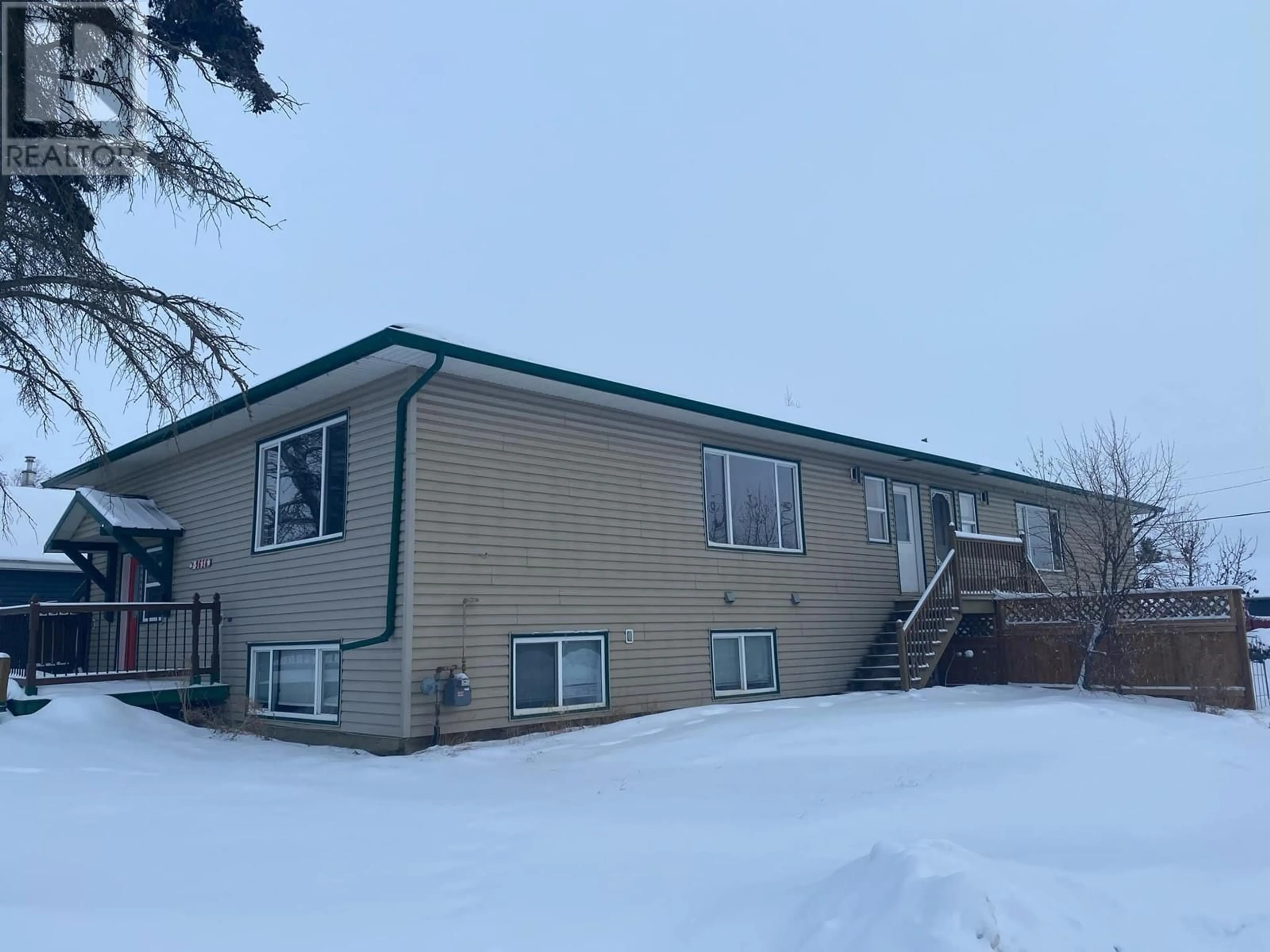 A pic from outside/outdoor area/front of a property/back of a property/a pic from drone, unknown for 9636 15 Street Unit# 2, Dawson Creek British Columbia V1G3Y9