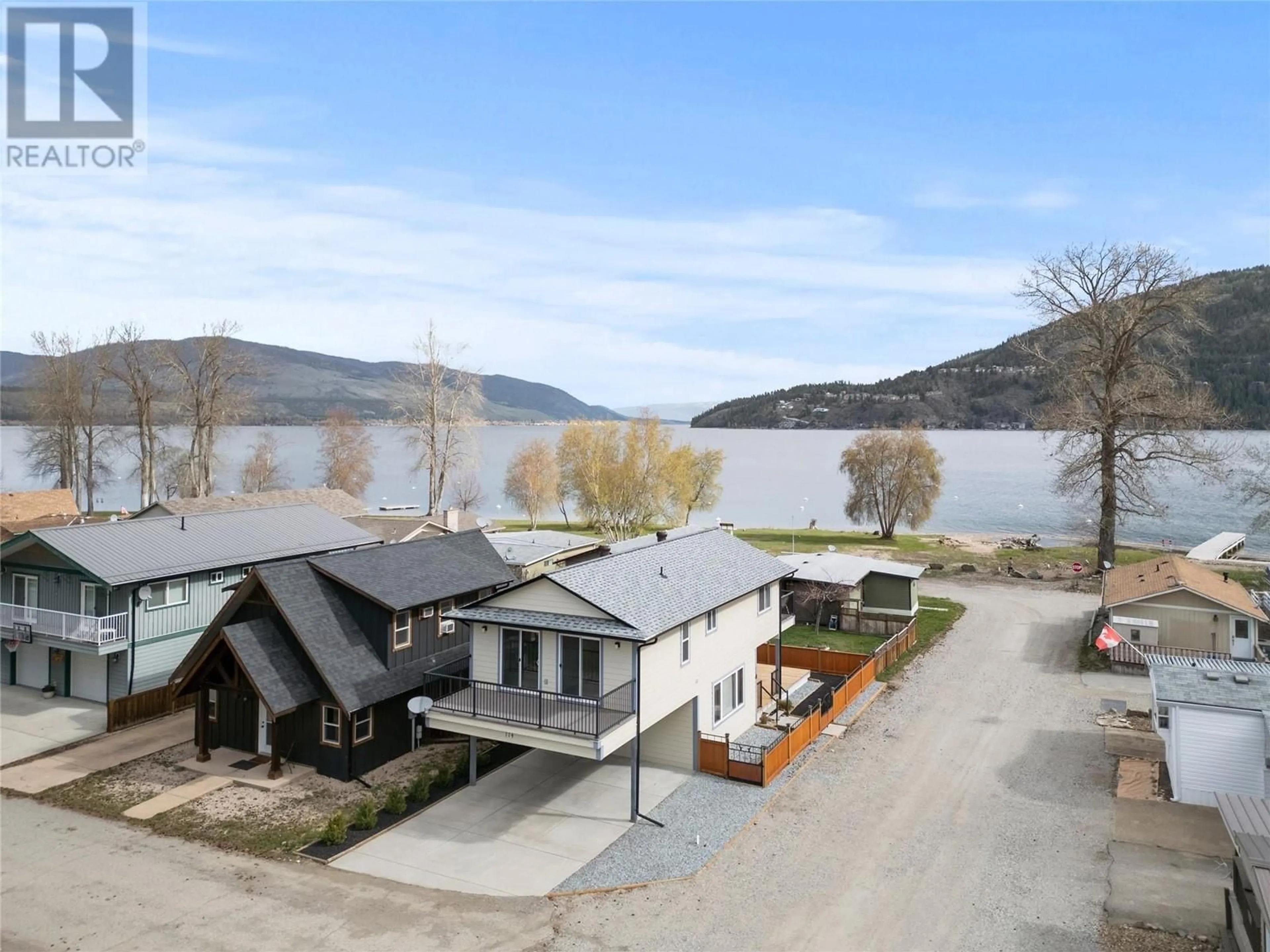 A pic from outside/outdoor area/front of a property/back of a property/a pic from drone, water/lake/river/ocean view for 114 Elk Street, Vernon British Columbia V1H2A1