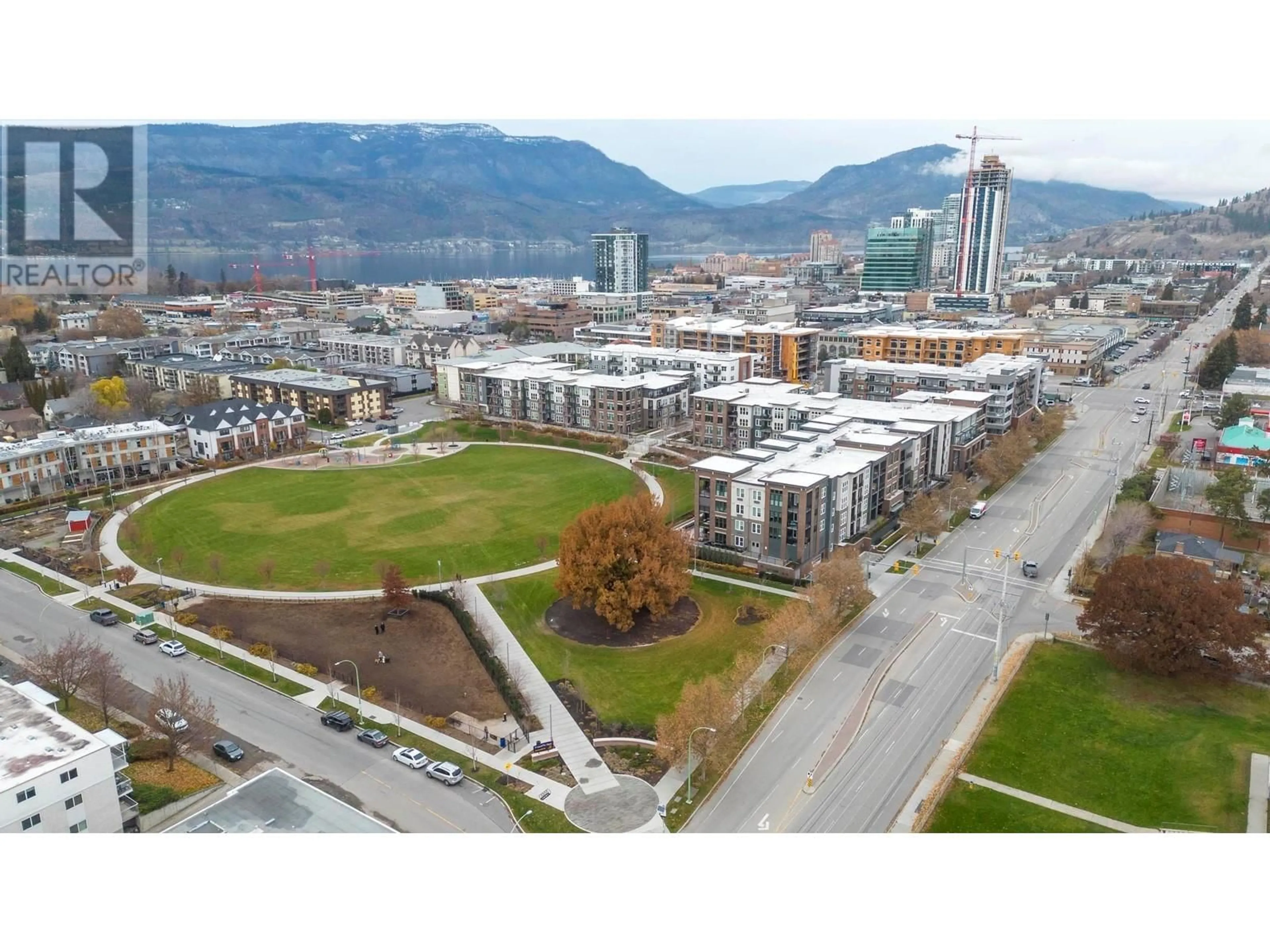 A pic from outside/outdoor area/front of a property/back of a property/a pic from drone, mountain view for 1770 Richter Street Unit# 206, Kelowna British Columbia V1Y0E6