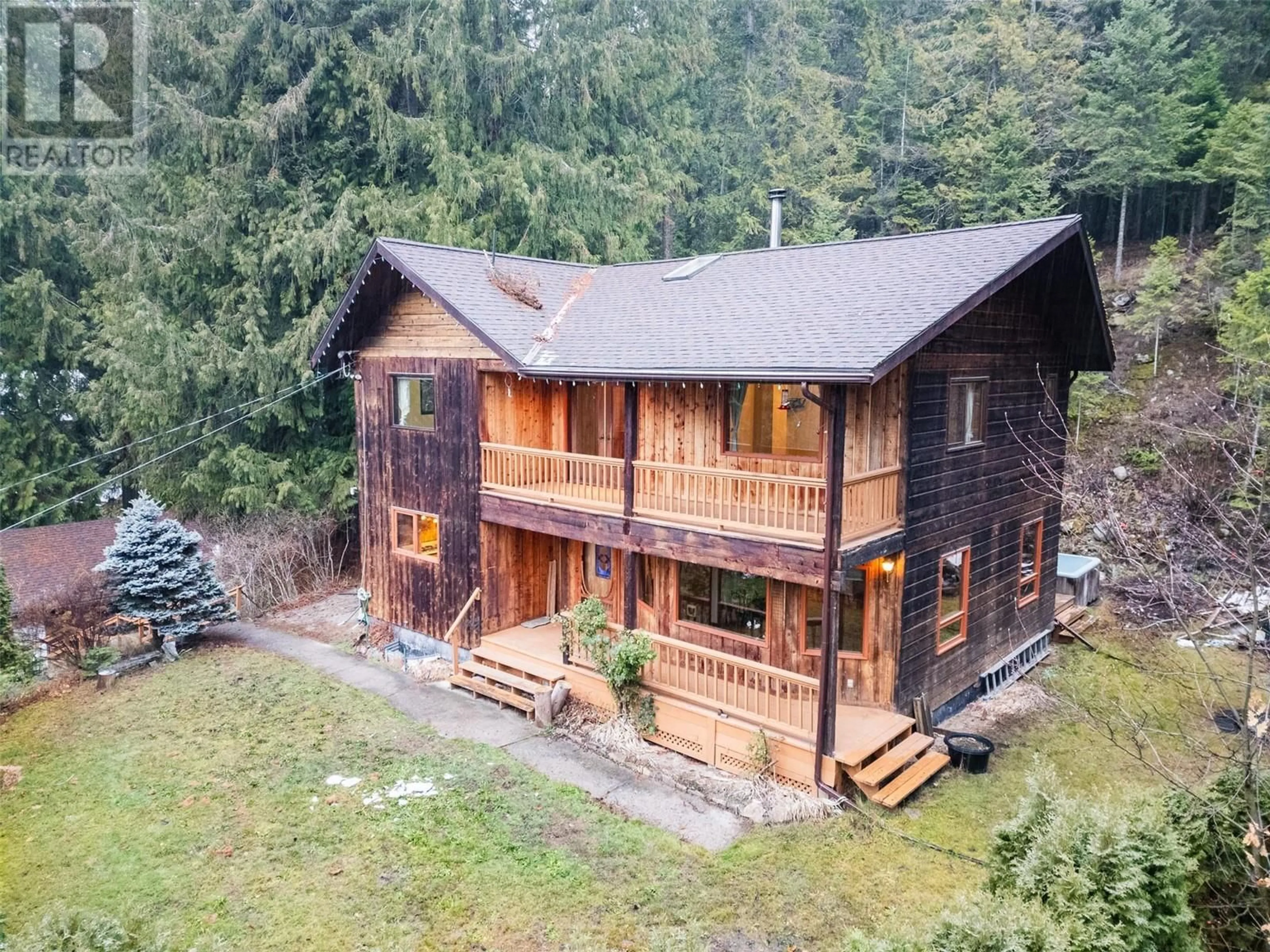 A pic from outside/outdoor area/front of a property/back of a property/a pic from drone, building for 5671 Longbeach Road, Nelson British Columbia V1L6N9