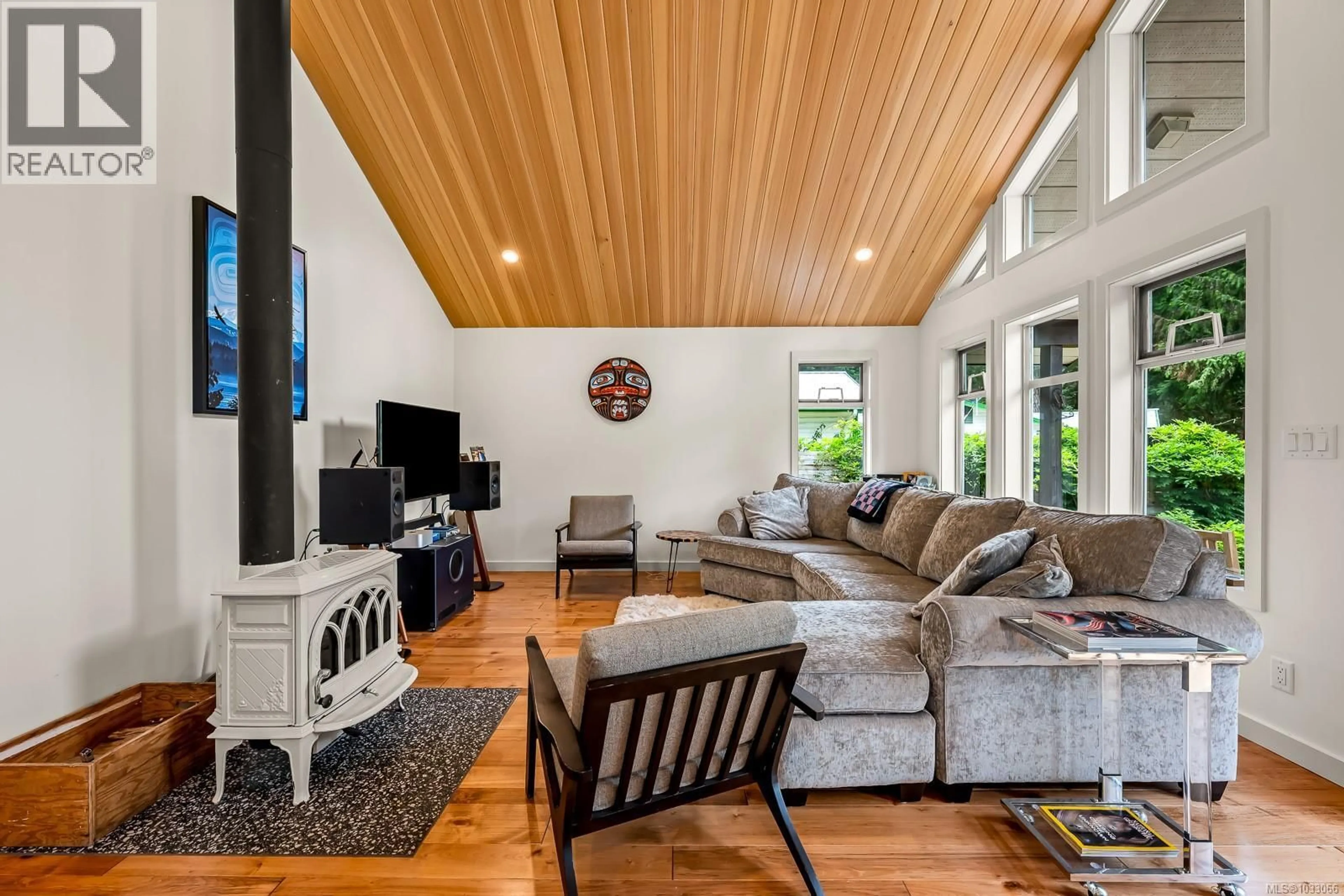 Living room with furniture, wood/laminate floor for 1677 BAIKIE ROAD, Denman Island British Columbia V0R1T0