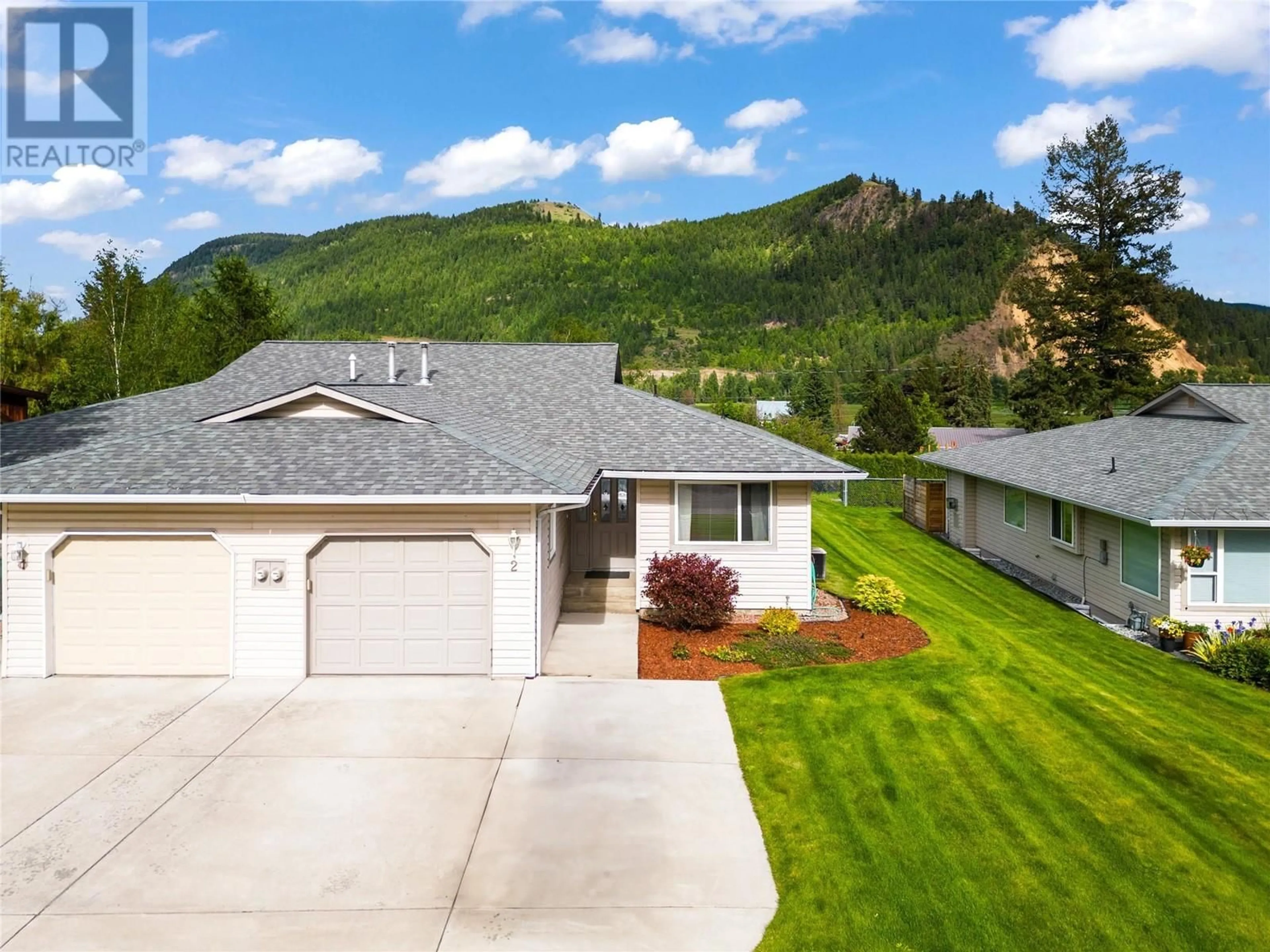 A pic from outside/outdoor area/front of a property/back of a property/a pic from drone, mountain view for 2675 Pine Avenue Unit# 2, Lumby British Columbia V0E2G0