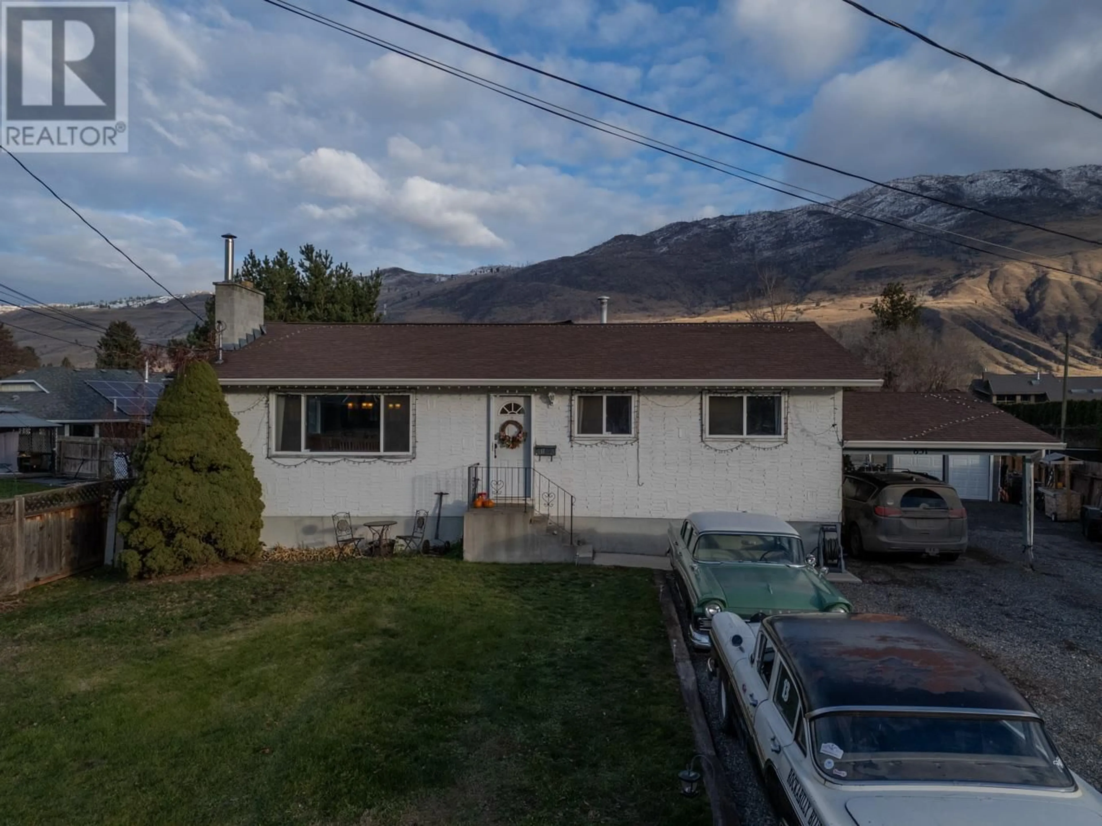 A pic from outside/outdoor area/front of a property/back of a property/a pic from drone, mountain view for 651 Bank Place, Kamloops British Columbia V2B7M1