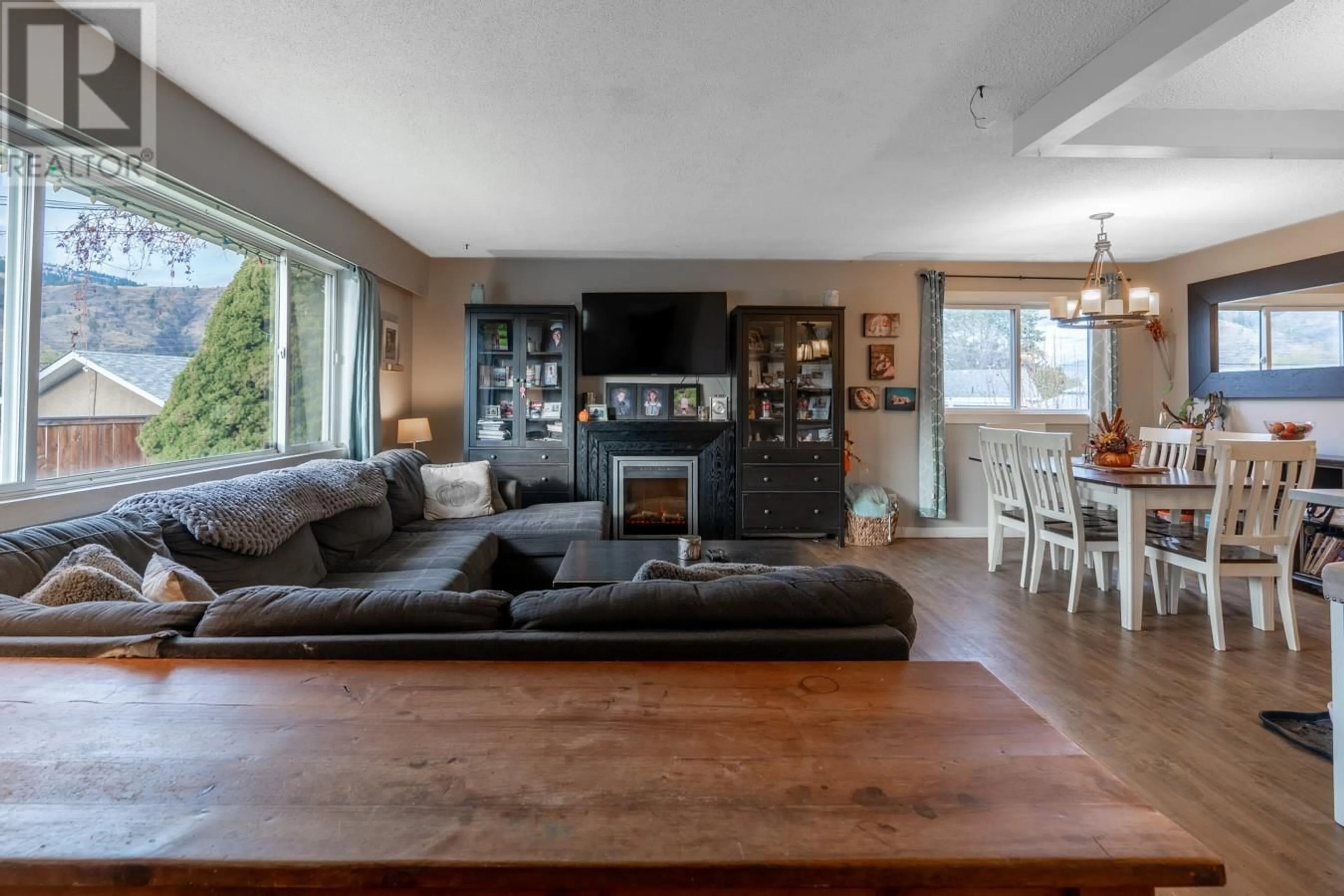 Living room with furniture, wood/laminate floor for 651 Bank Place, Kamloops British Columbia V2B7M1