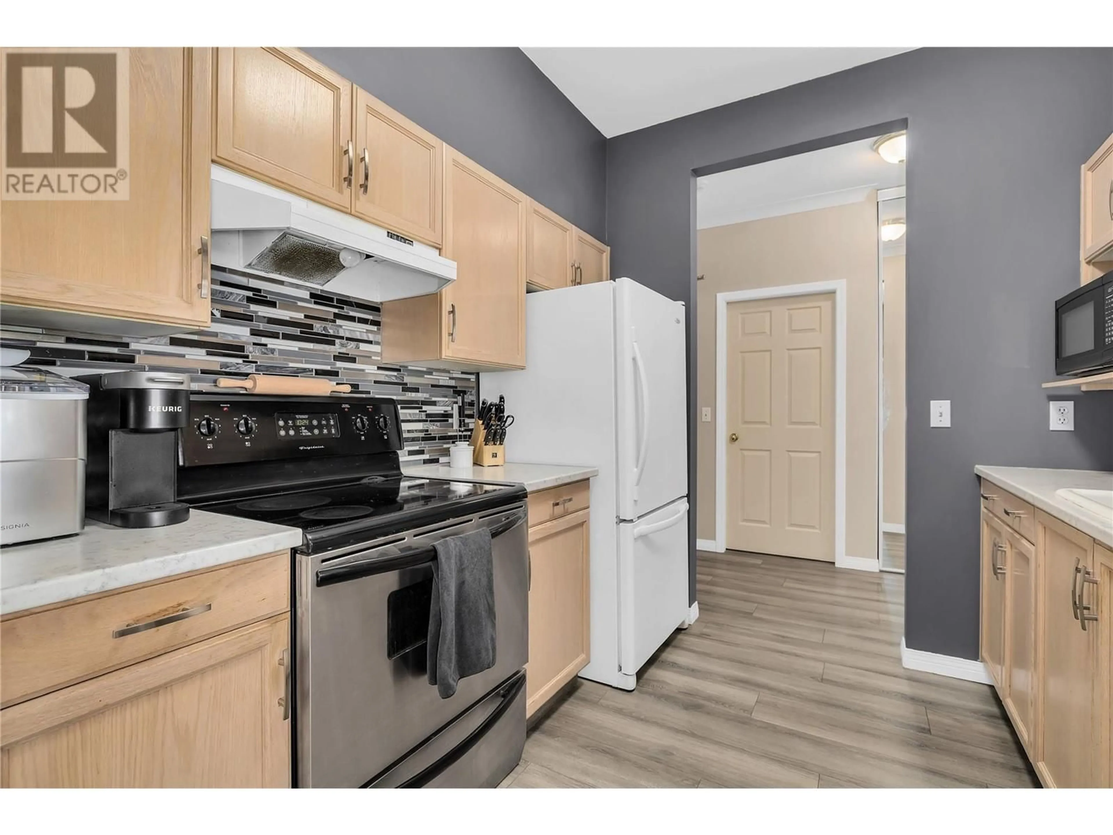 Standard kitchen, wood/laminate floor for 255 Aurora Crescent Unit# 304, Kelowna British Columbia V1X7L8