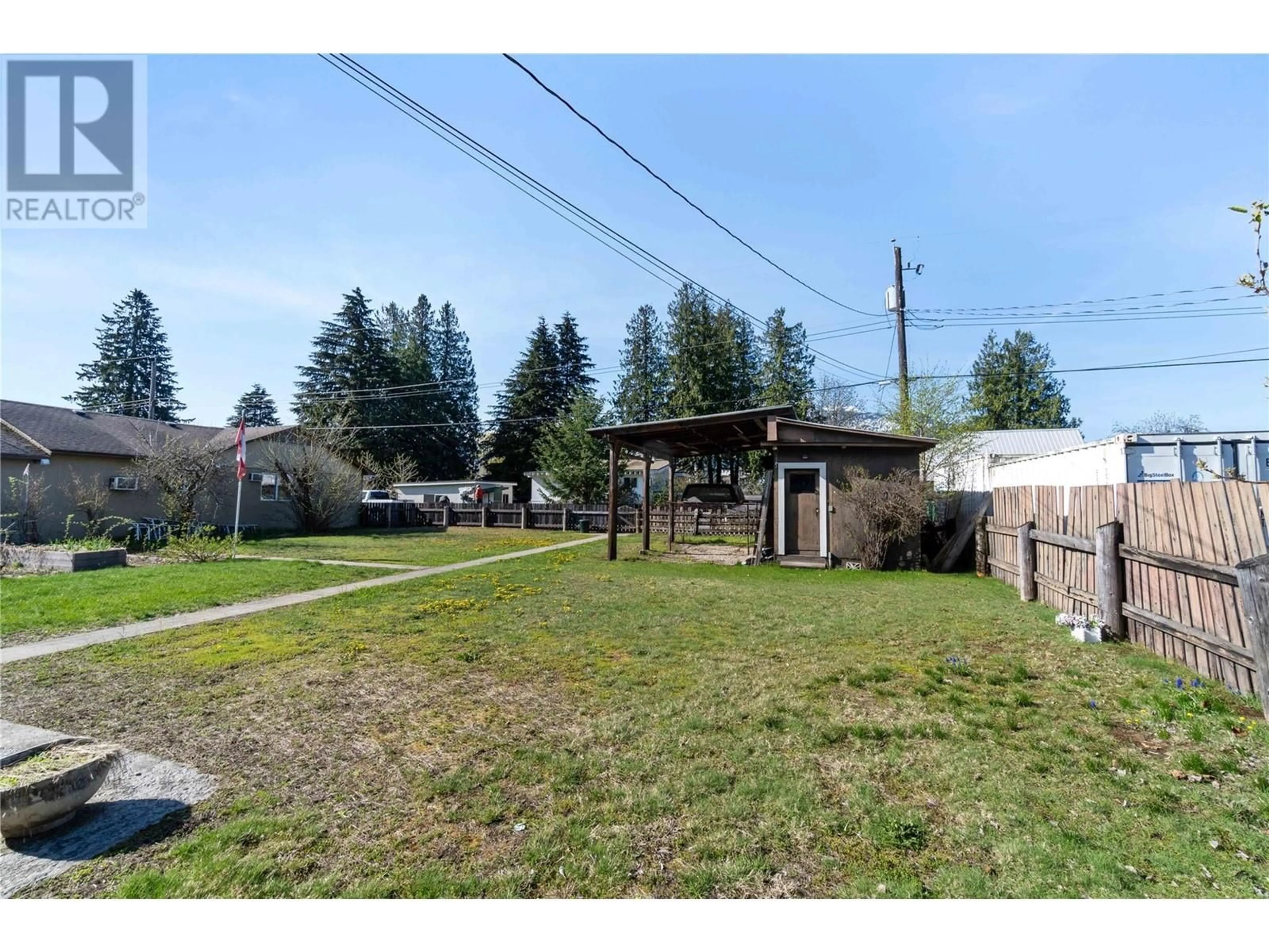 A pic from outside/outdoor area/front of a property/back of a property/a pic from drone, street for 1115 VICTORIA ROAD WEST, Revelstoke British Columbia V0E2S0
