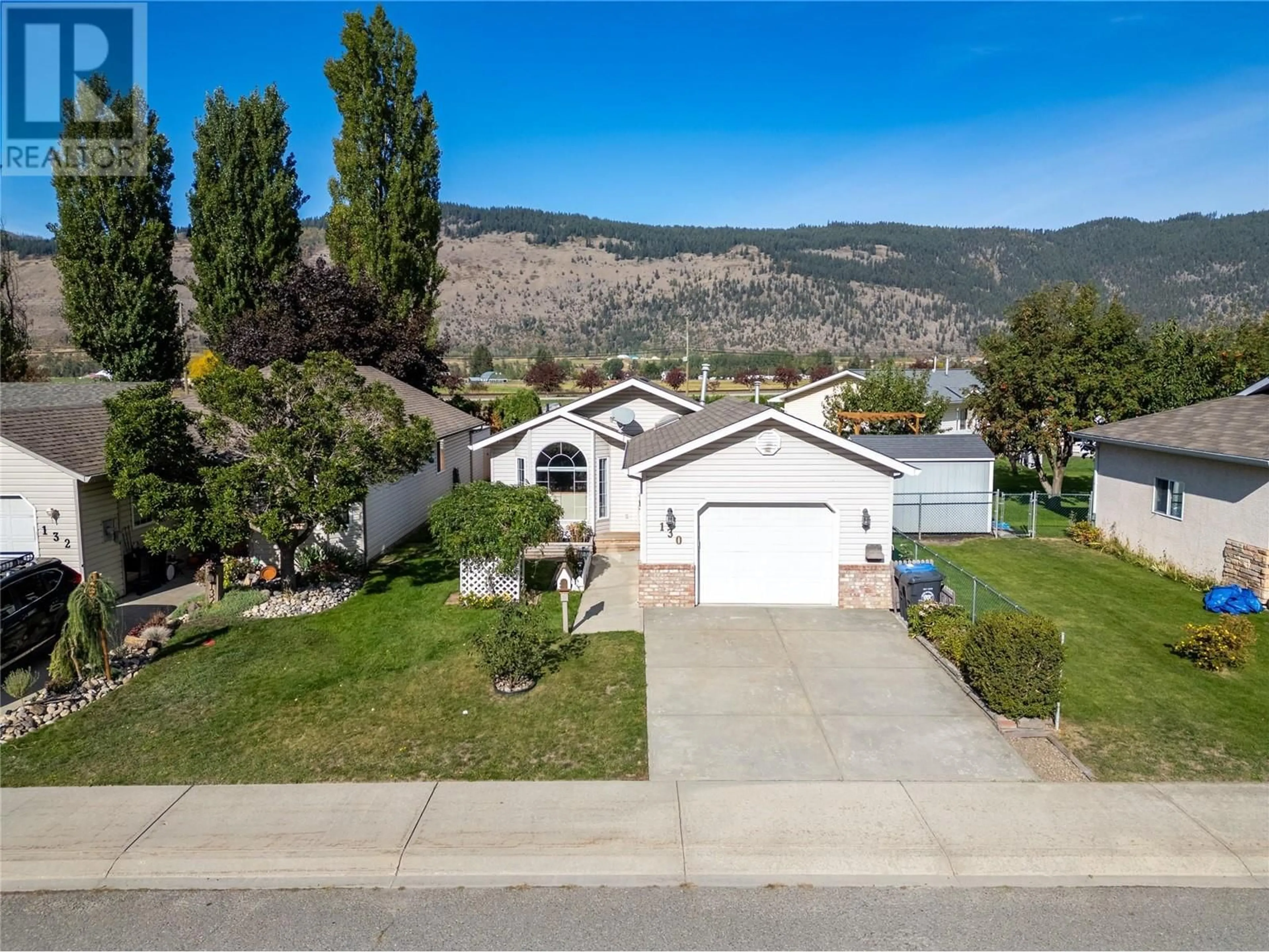 A pic from outside/outdoor area/front of a property/back of a property/a pic from drone, mountain view for 130 Leighton Avenue, Chase British Columbia V0E1M0