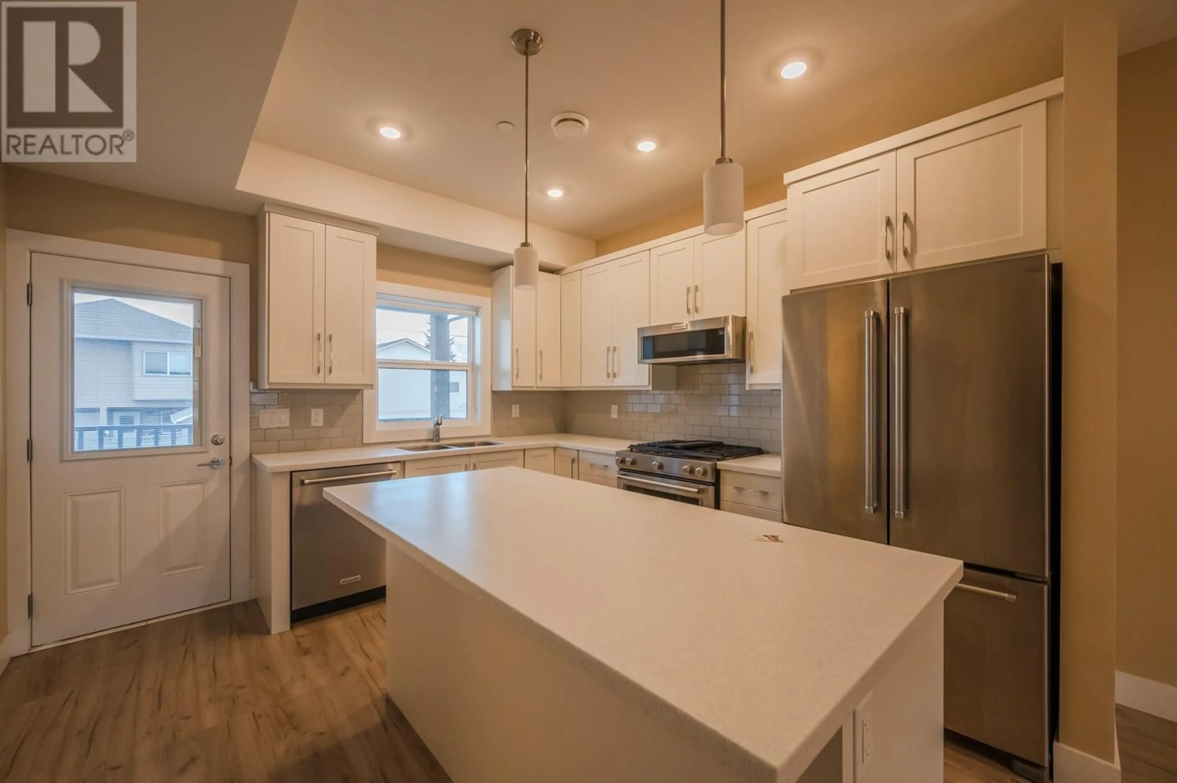 Open concept kitchen, unknown for 651 Braid Street Unit# 101, Penticton British Columbia V2A4Y6