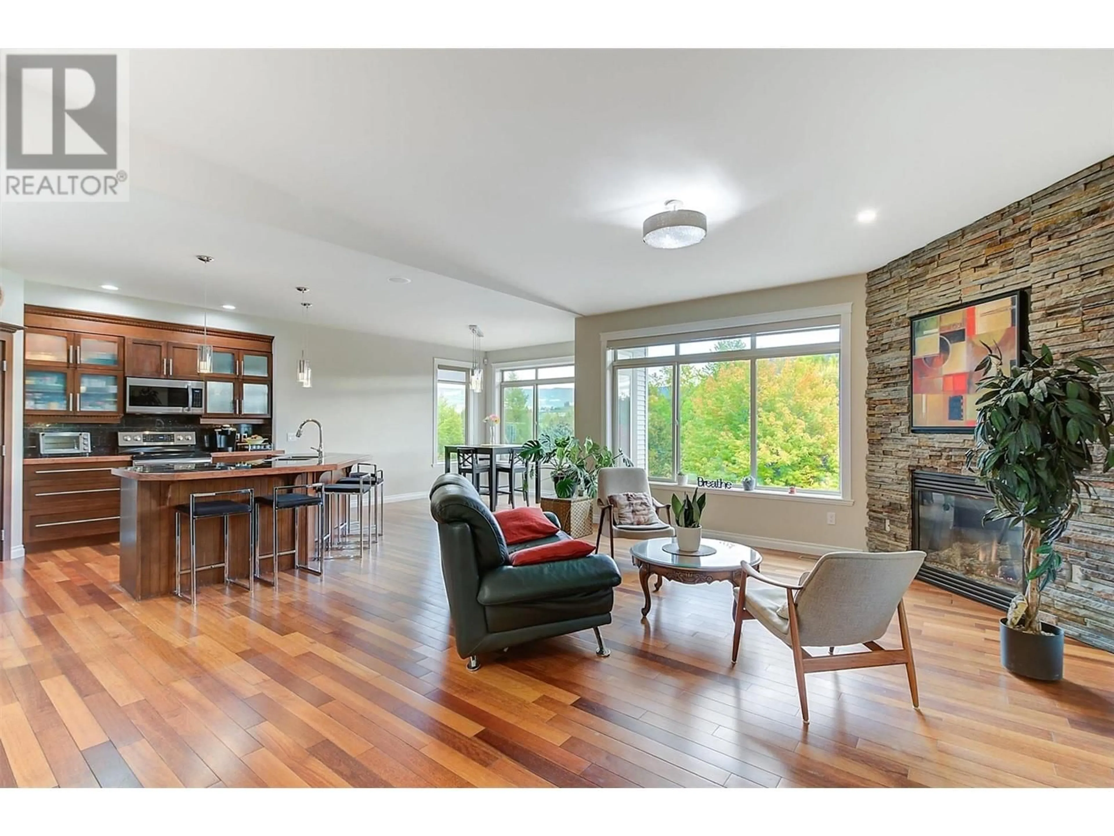 Open concept kitchen, wood/laminate floor for 115 - 550 GLENMEADOWS ROAD, Kelowna British Columbia V1V1X3
