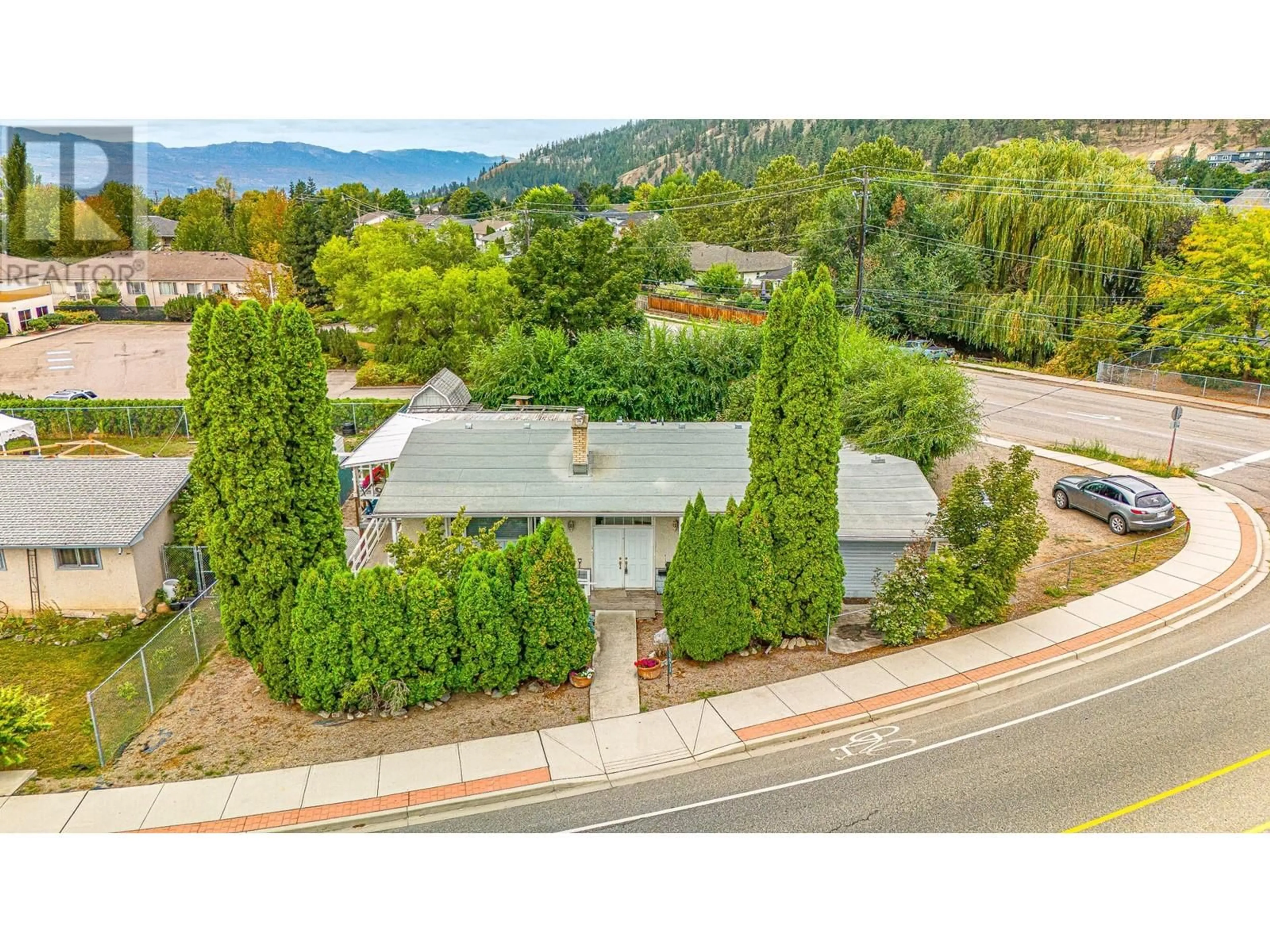 A pic from outside/outdoor area/front of a property/back of a property/a pic from drone, mountain view for 1911 Cross Road, Kelowna British Columbia V1V2E4