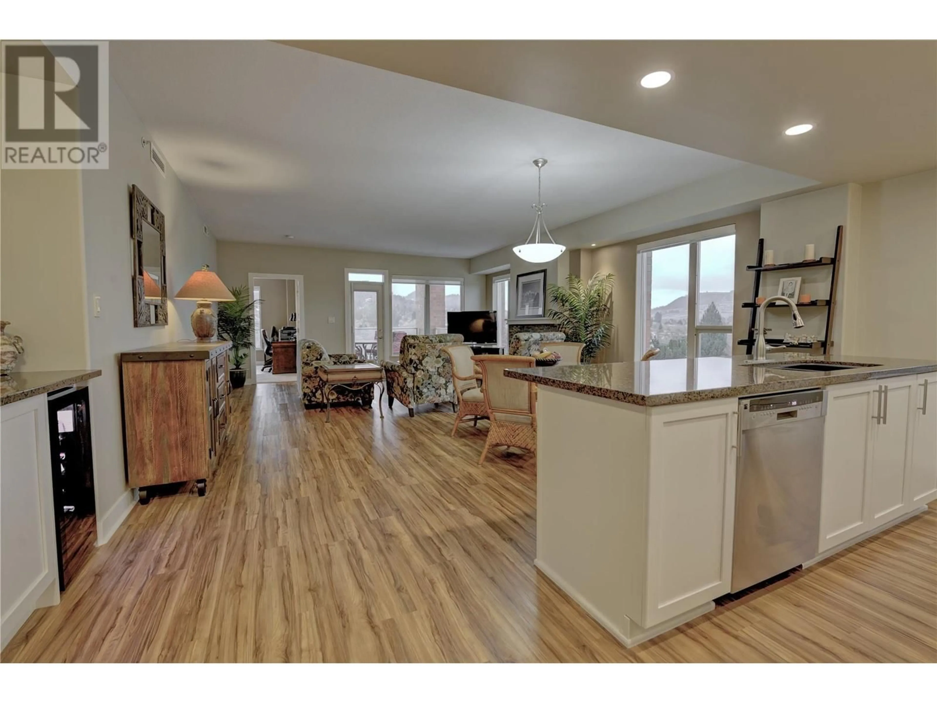 Open concept kitchen, wood/laminate floor for 1160 Bernard Avenue Unit# 502, Kelowna British Columbia V1Y6R2