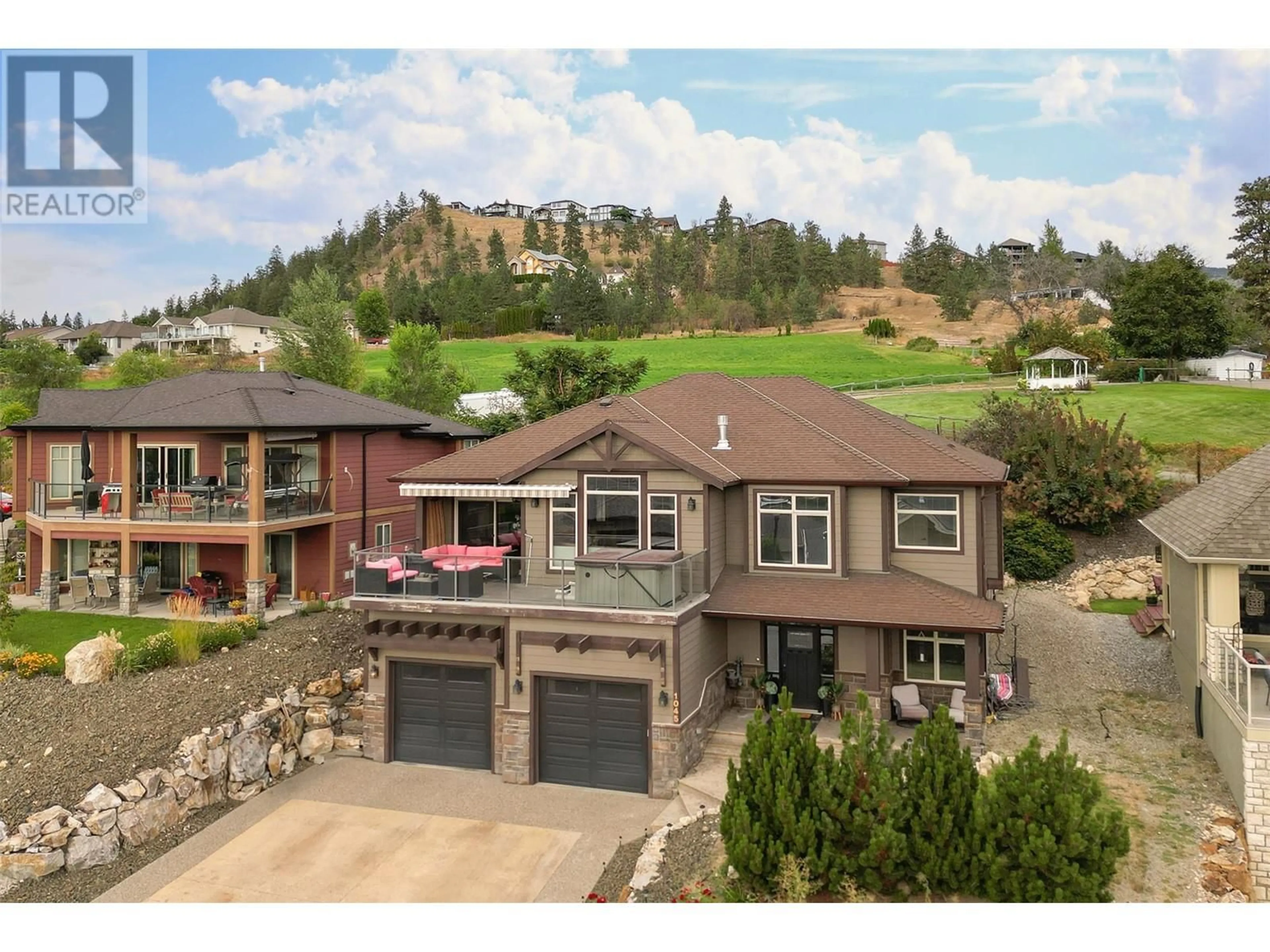 A pic from outside/outdoor area/front of a property/back of a property/a pic from drone, mountain view for 1045 Hume Avenue, Kelowna British Columbia V1P1P2