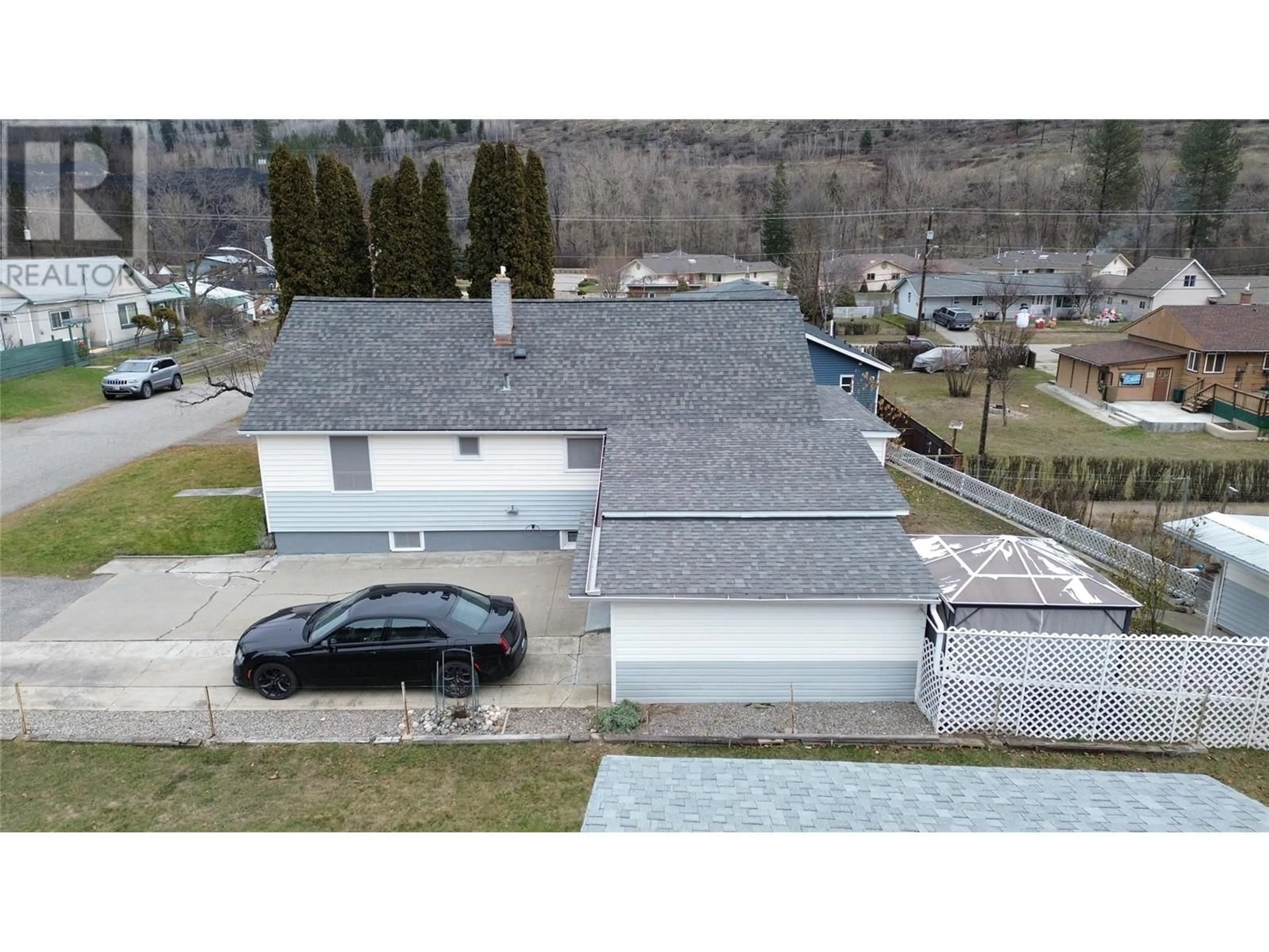 A pic from outside/outdoor area/front of a property/back of a property/a pic from drone, street for 154 80TH Avenue, Grand Forks British Columbia V0H1H0