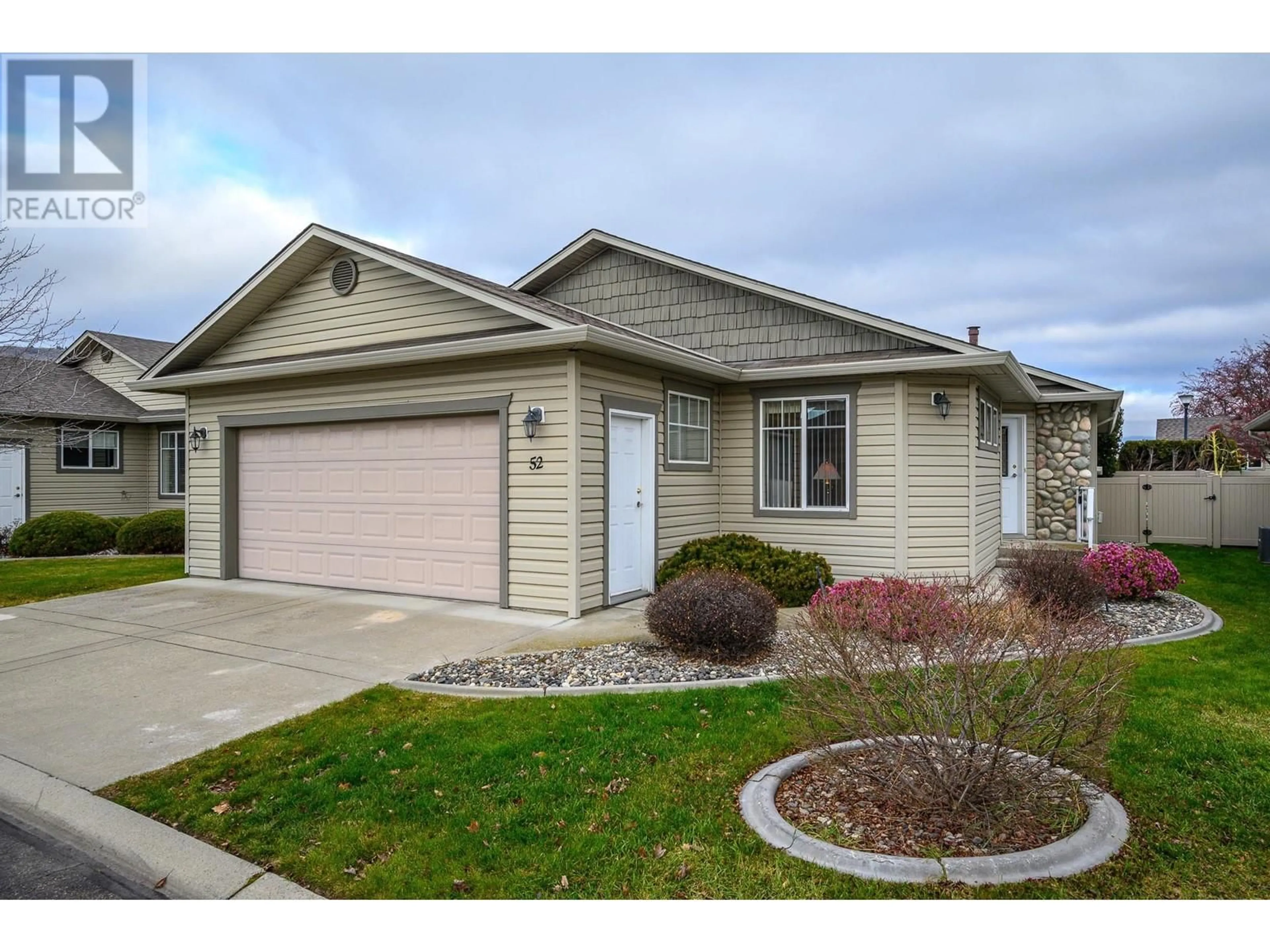 Home with vinyl exterior material, street for 5888 Okanagan Landing Road Unit# 52, Vernon British Columbia V1H1S2