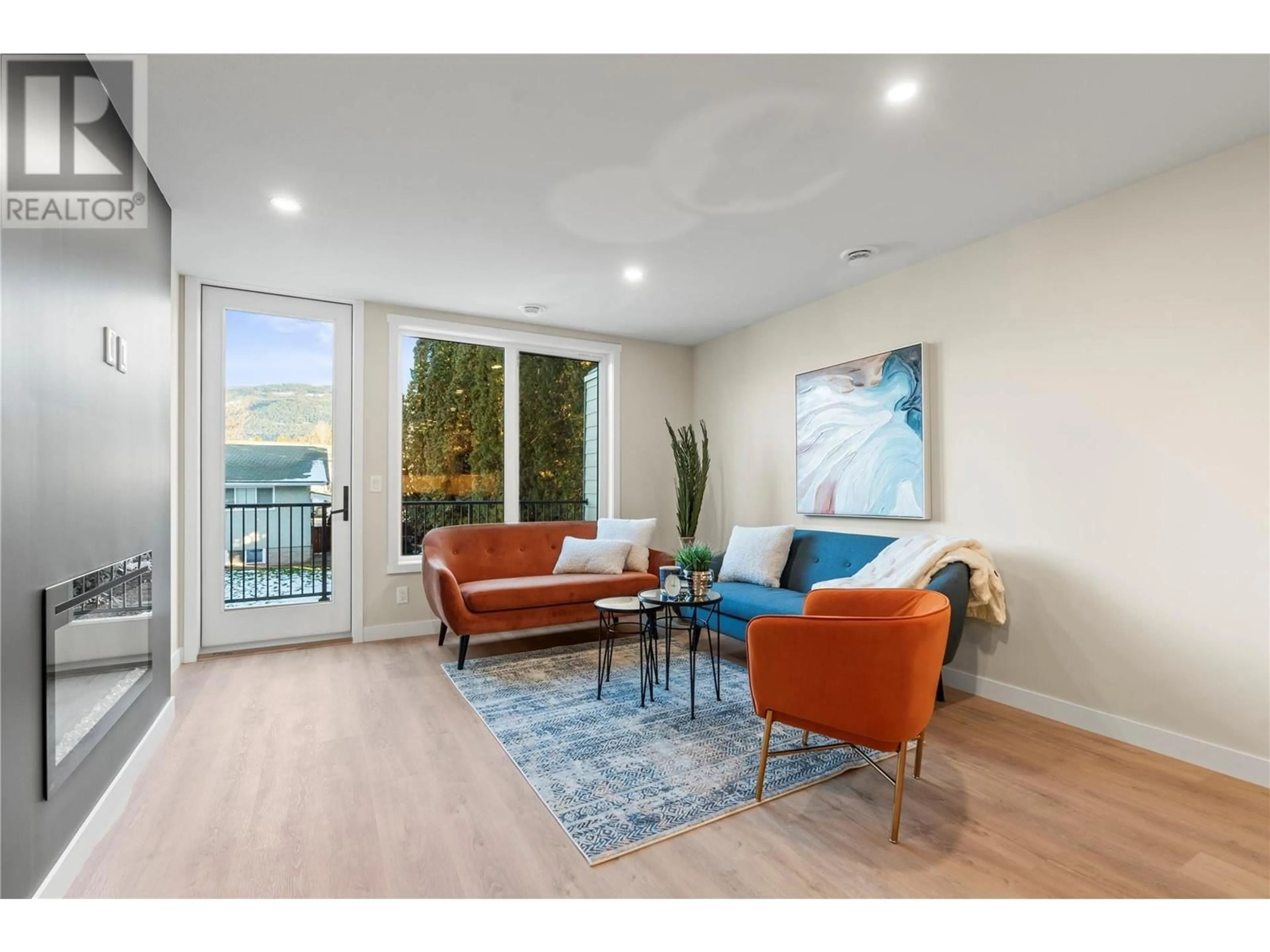 Living room with furniture, wood/laminate floor for 2 - 3907 26 STREET, Vernon British Columbia V1T4V5