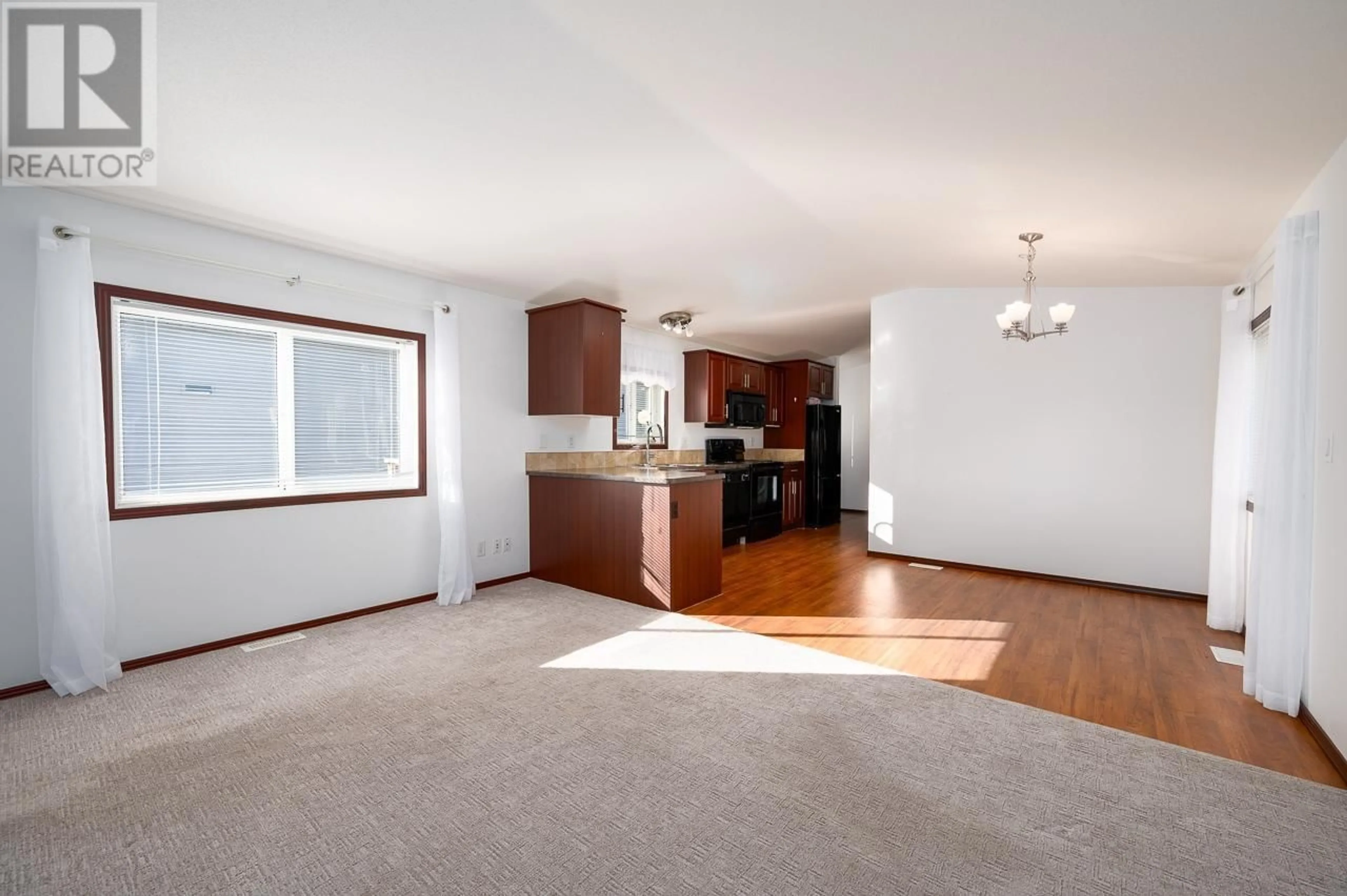 Open concept kitchen, wood/laminate floor for 7155 DALLAS Drive Unit# C10, Kamloops British Columbia V2C4T1