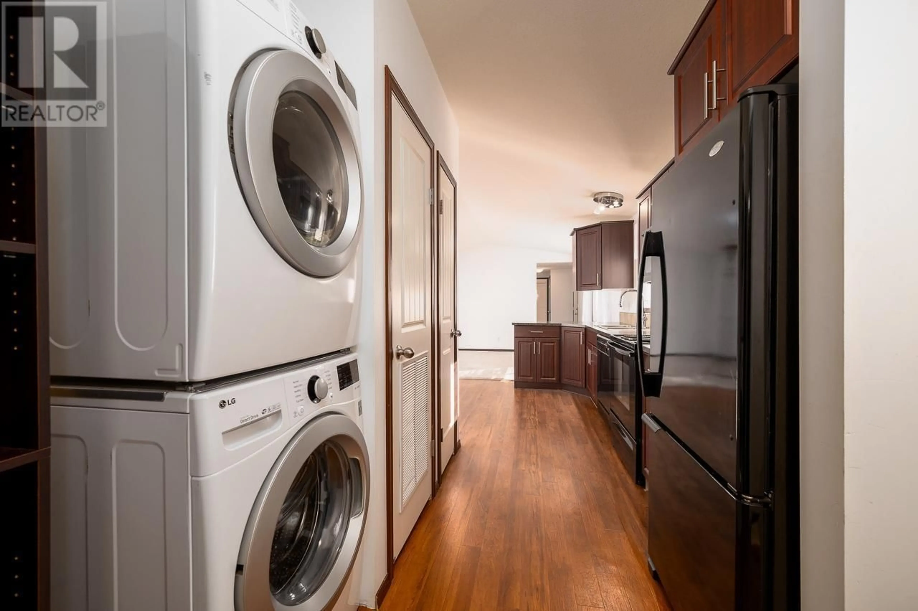 Kitchen with laundary machines, wood/laminate floor for 7155 DALLAS Drive Unit# C10, Kamloops British Columbia V2C4T1