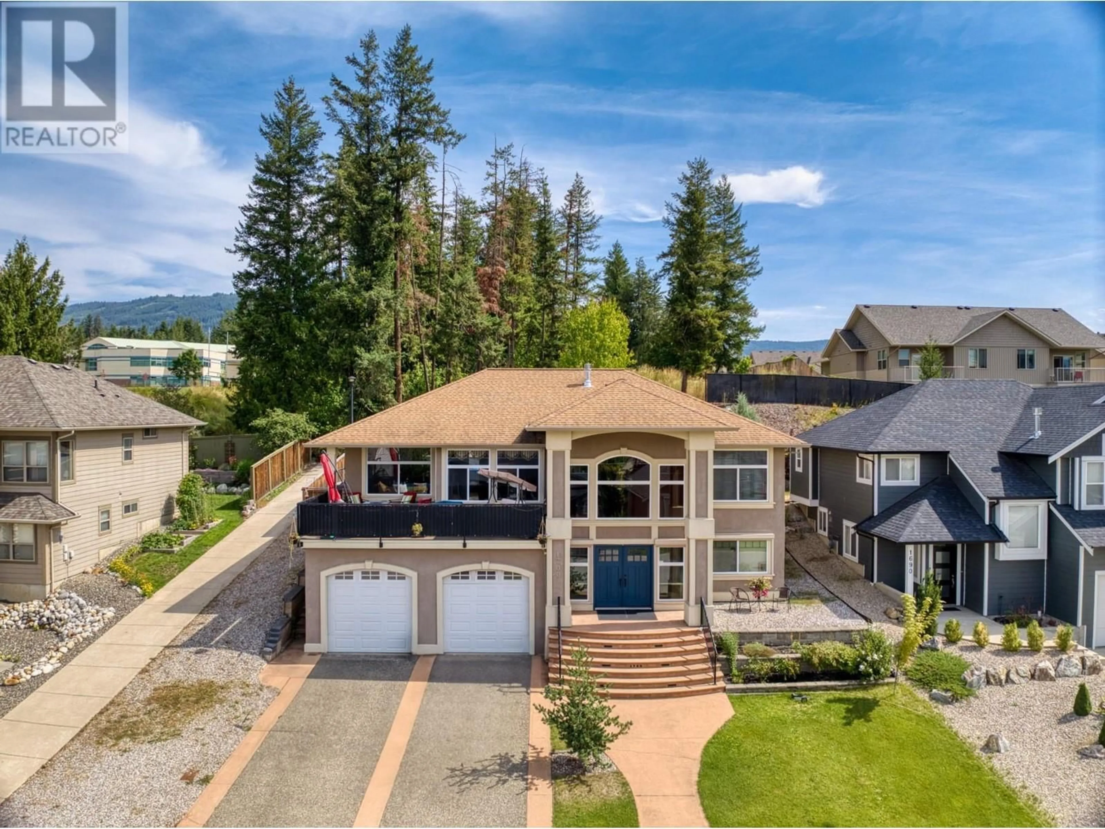 A pic from outside/outdoor area/front of a property/back of a property/a pic from drone, unknown for 1700 24 Street NE, Salmon Arm British Columbia V1E3M5